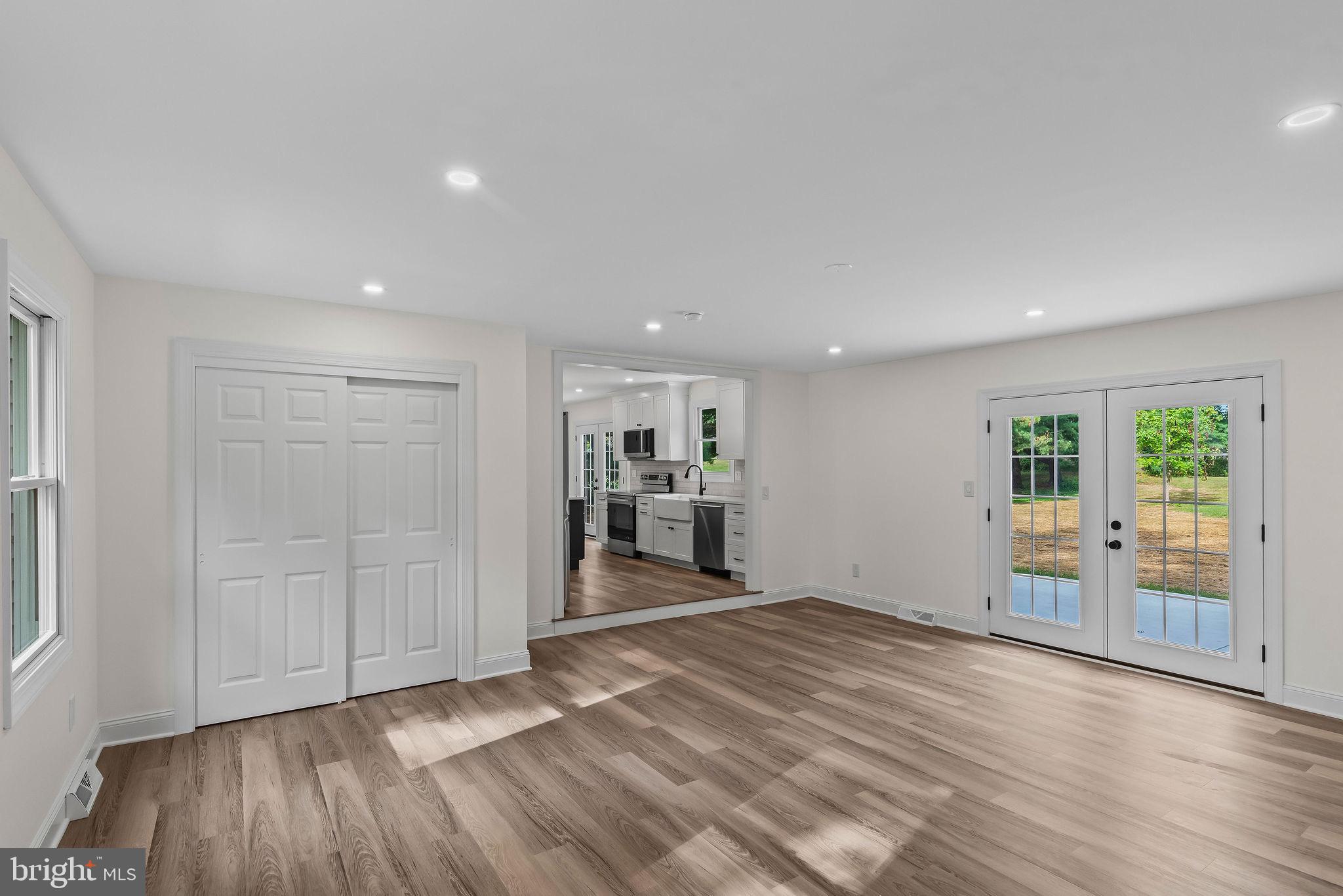 5925 Corrigan Road Doylestown, PA 18902 - Photo 14 of 64 an empty room with wooden floor and windows