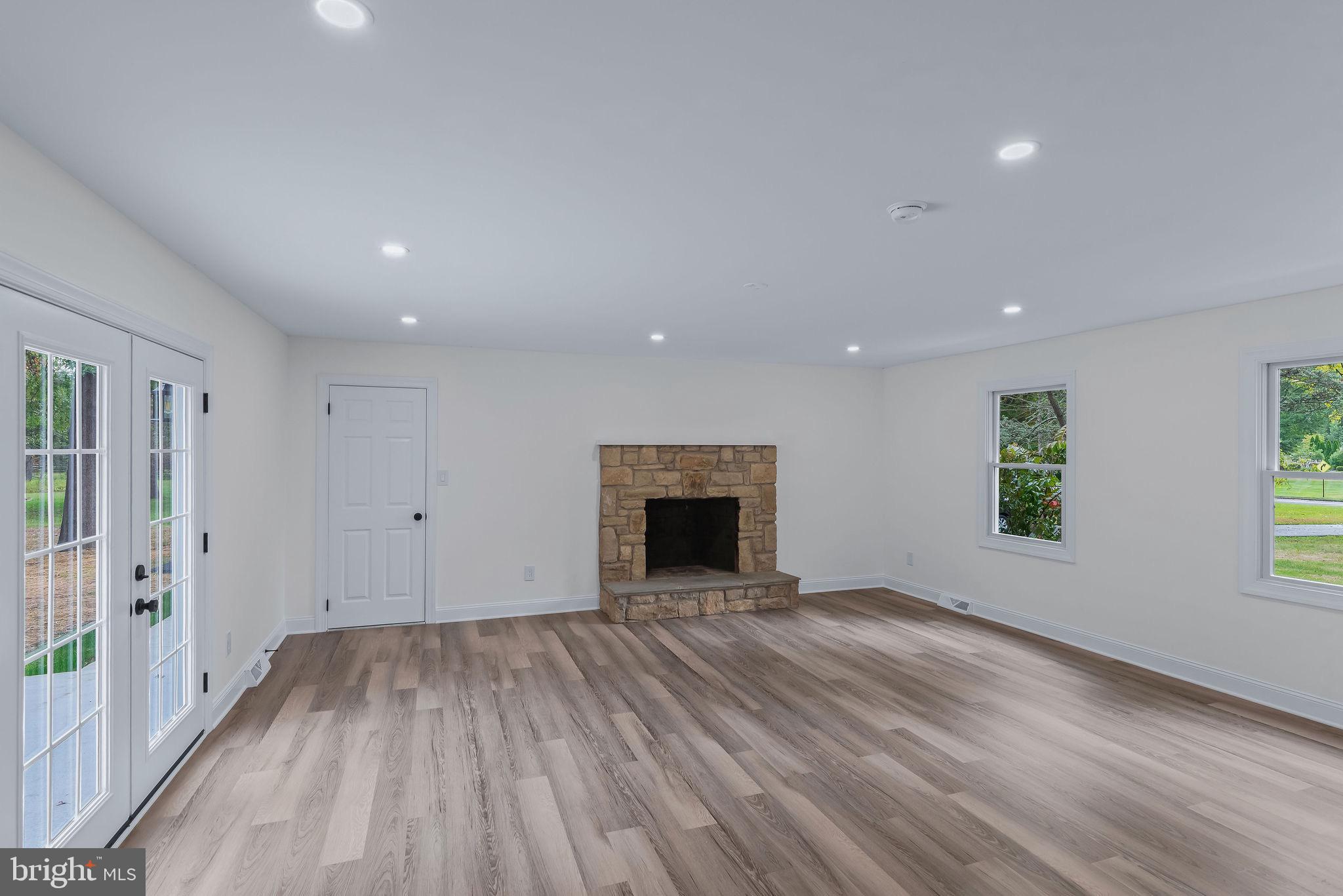 5925 Corrigan Road Doylestown, PA 18902 - Photo 16 of 64 a view of an empty room with wooden floor and a window
