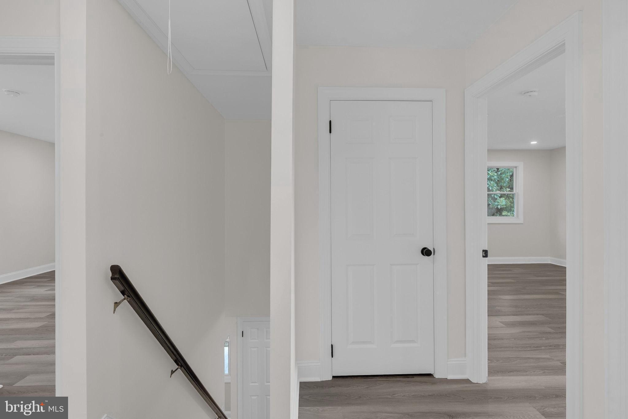 5925 Corrigan Road Doylestown, PA 18902 - Photo 25 of 64 a view of a hallway with wooden floor