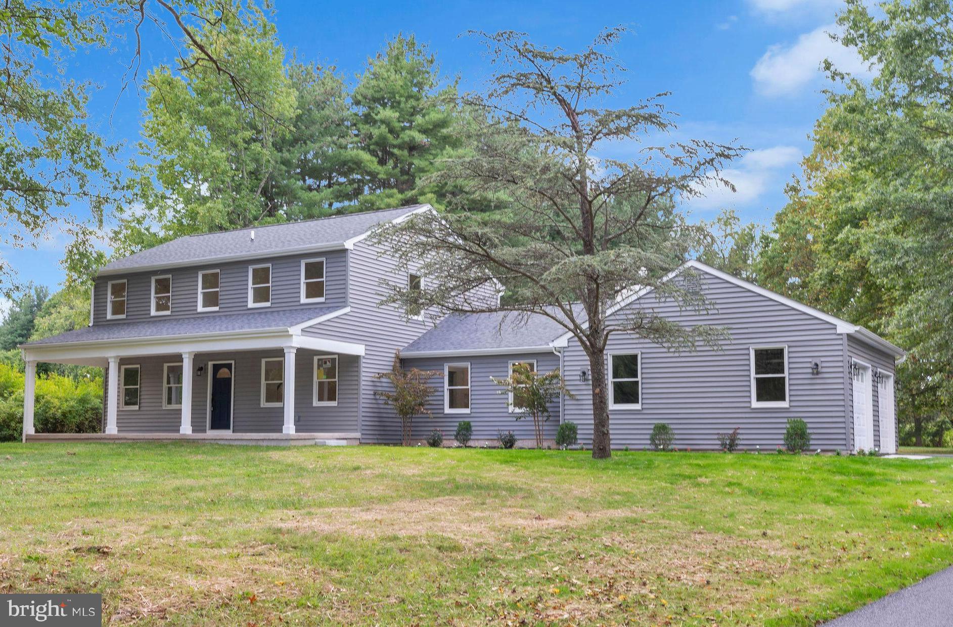 5925 Corrigan Road Doylestown, PA 18902 - Photo 3 of 64 a front view of a house with a garden