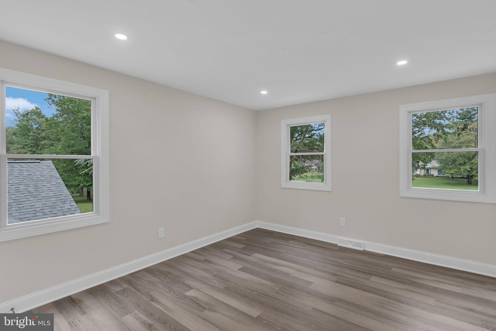 5925 Corrigan Road Doylestown, PA 18902 - Photo 36 of 64 a view of a room with wooden floor and windows
