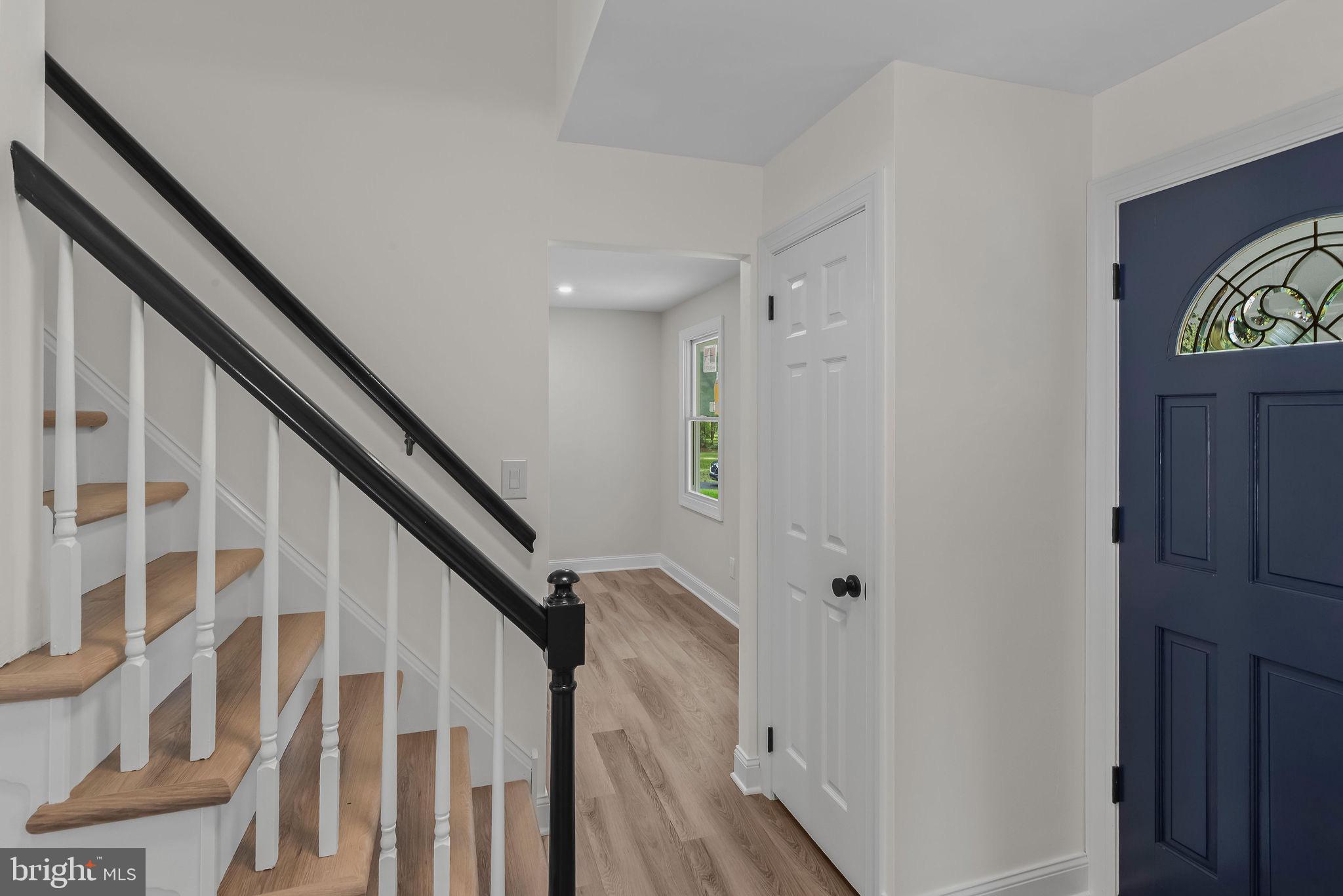 5925 Corrigan Road Doylestown, PA 18902 - Photo 37 of 64 a view of entryway with wooden floor and stairs