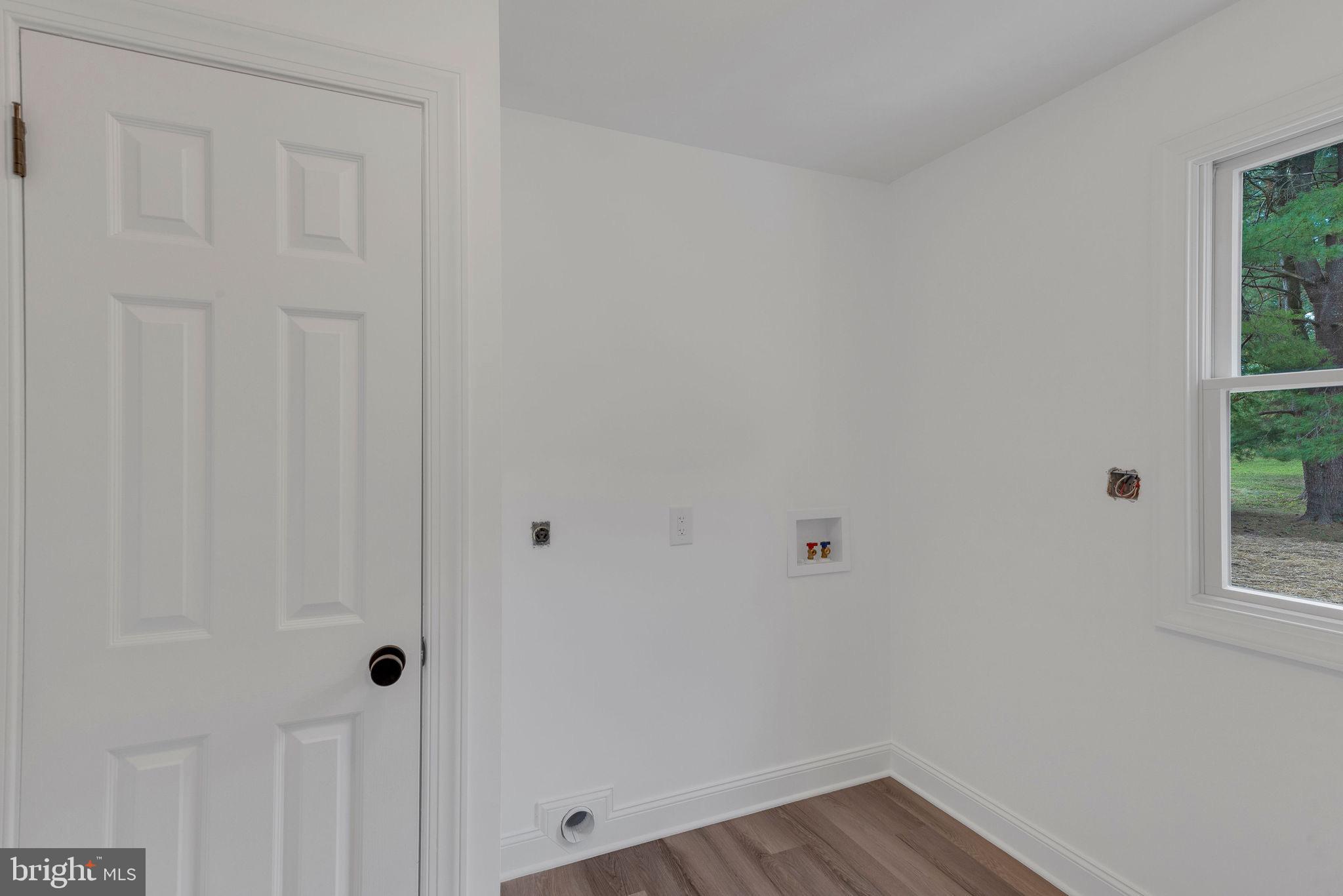 5925 Corrigan Road Doylestown, PA 18902 - Photo 38 of 64 a view of a small space with wooden floor and a window