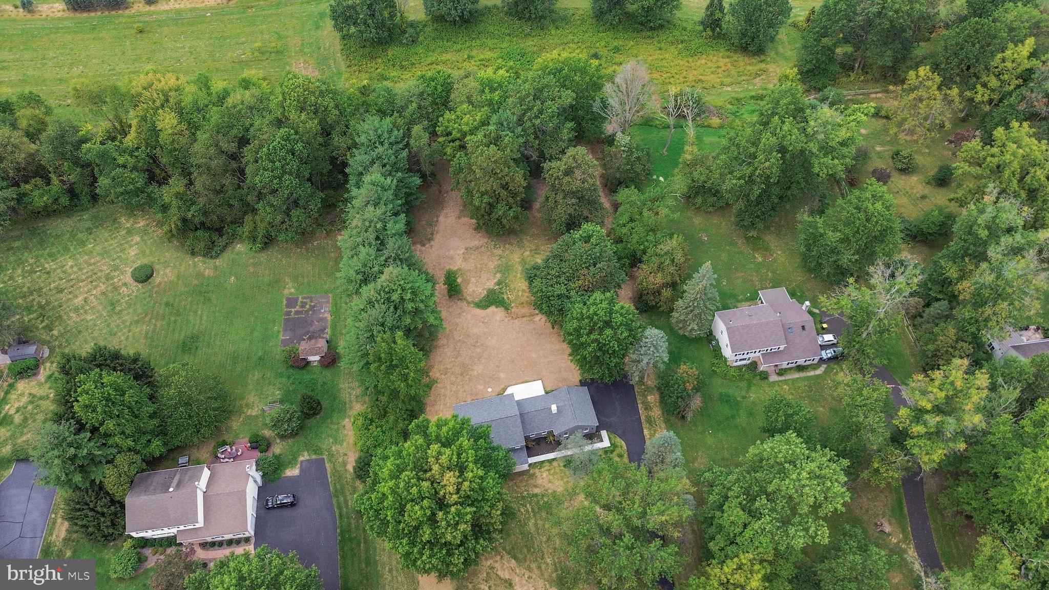 5925 Corrigan Road Doylestown, PA 18902 - Photo 48 of 64 an aerial view of a house with pool yard and outdoor seating