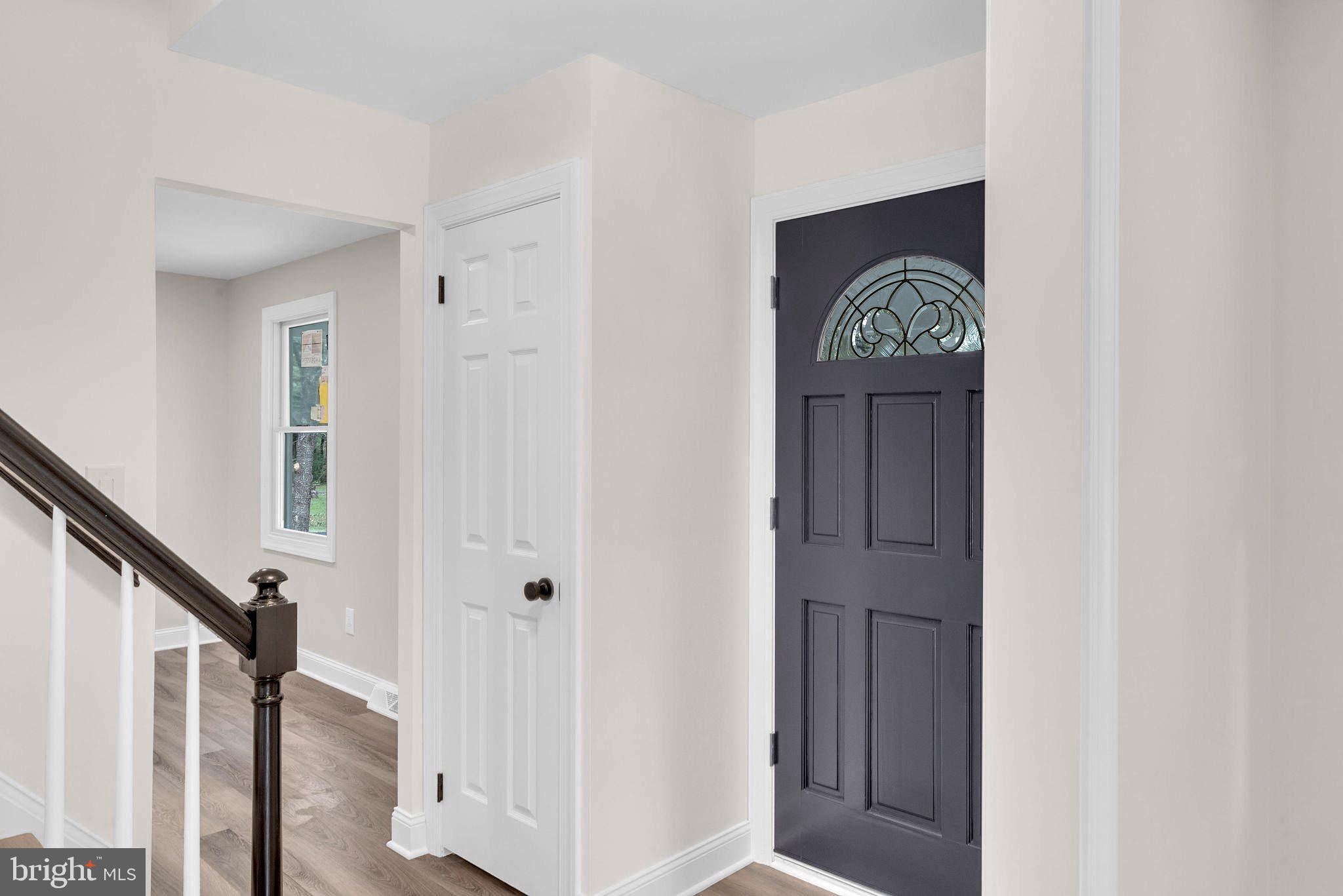 5925 Corrigan Road Doylestown, PA 18902 - Photo 5 of 64 a view of front door with stairs