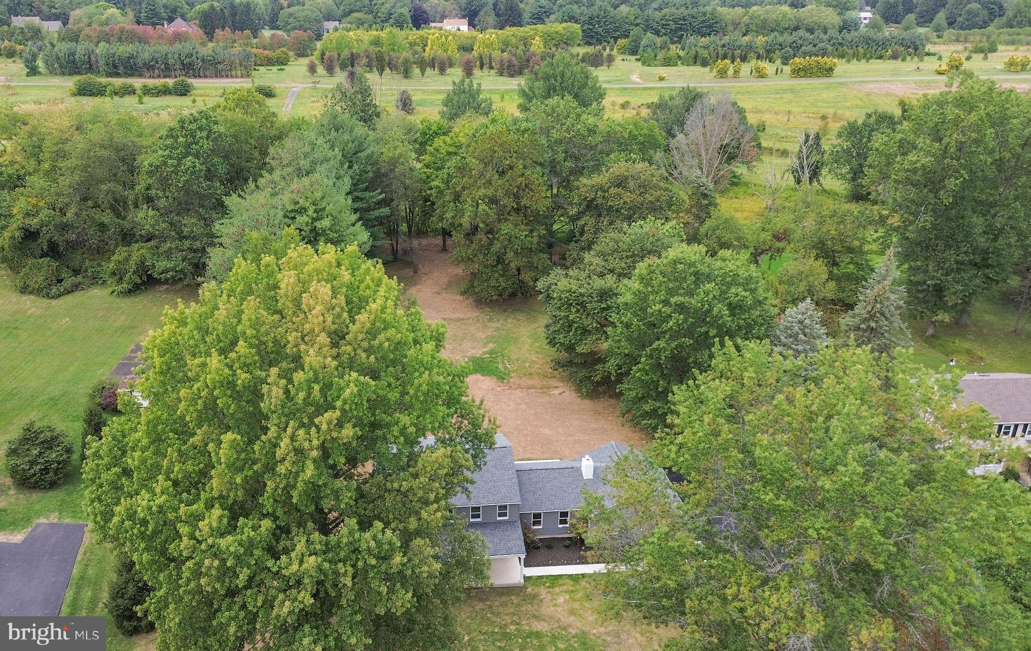 5925 Corrigan Road Doylestown, PA 18902 - Photo 54 of 64 a view of a lake with outdoor space and trees all around