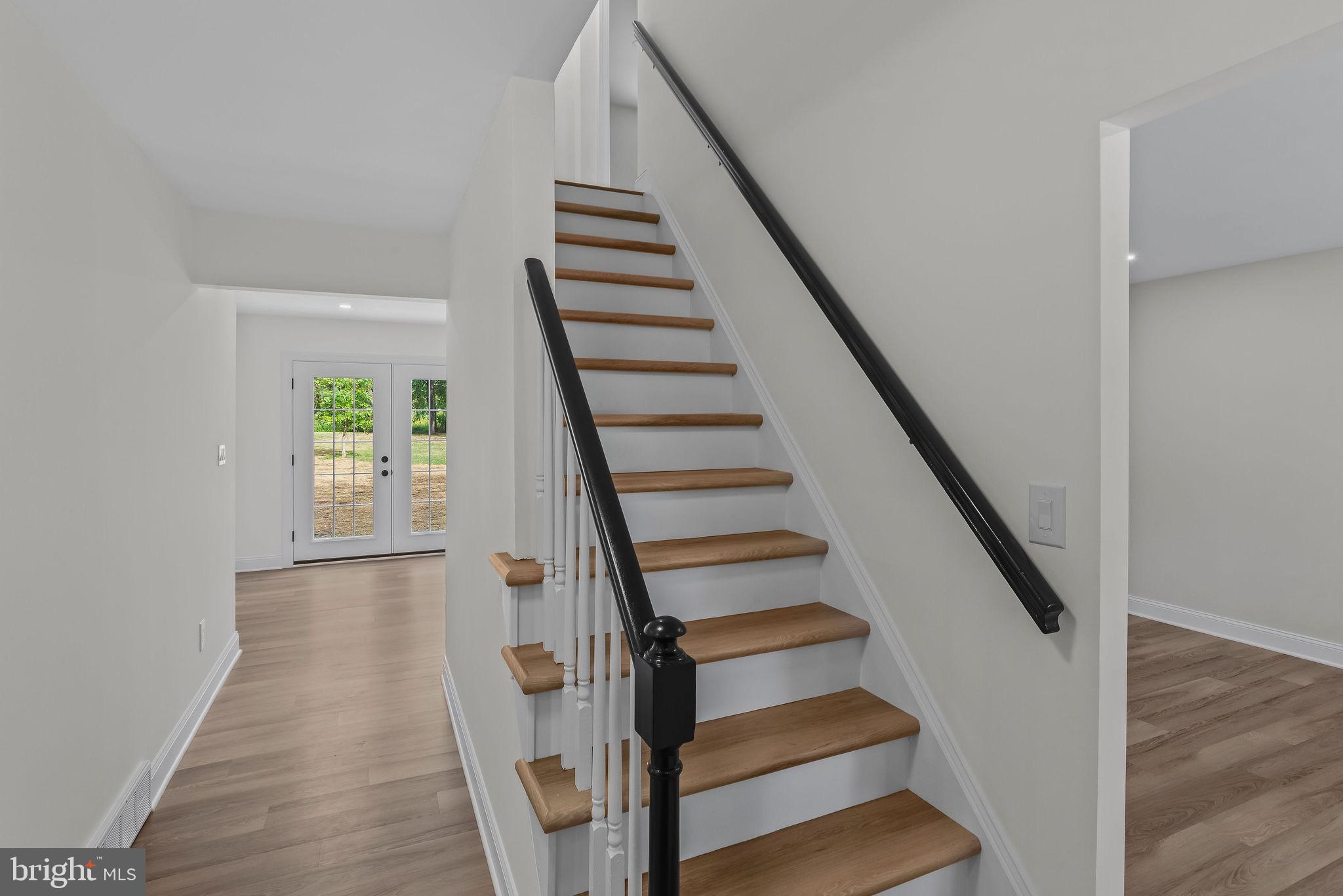 5925 Corrigan Road Doylestown, PA 18902 - Photo 6 of 64 a view of entryway and hall with wooden floor