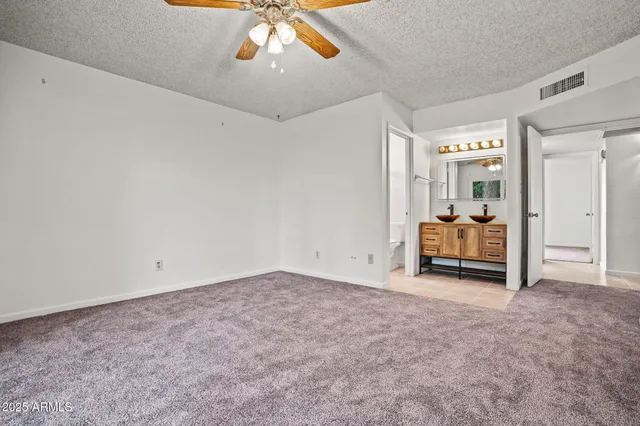 a view of a livingroom with furniture and a window
