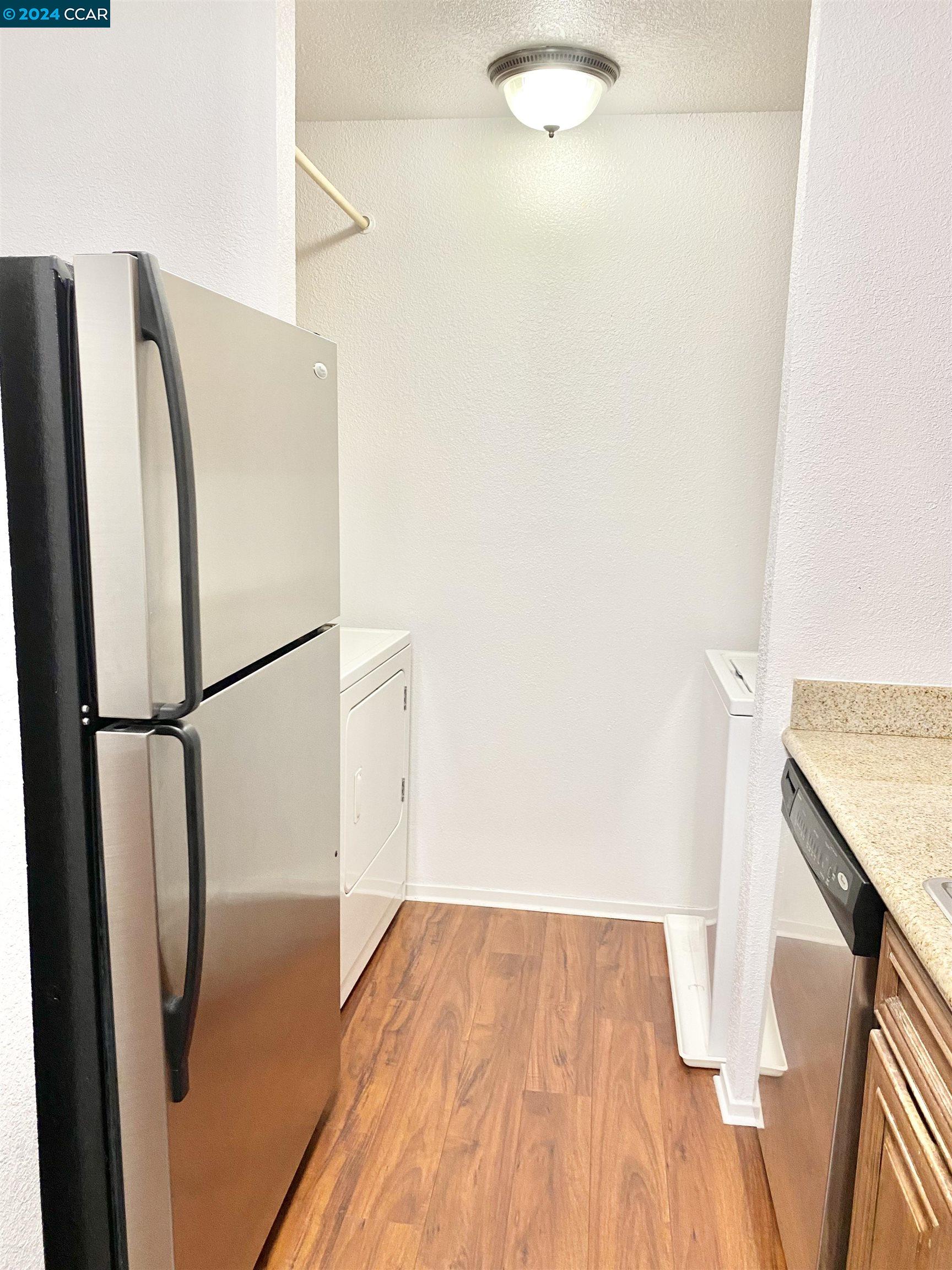 222 Piedmont Lane Pittsburg, CA 94565 - Photo 11 of 25 a view of a kitchen with wooden floor and a hallway