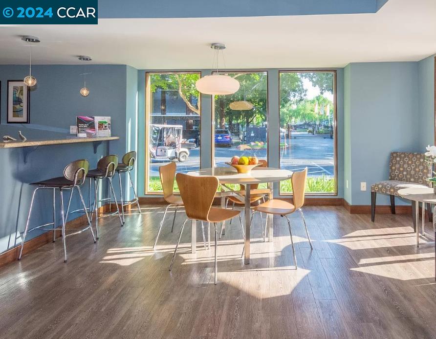 222 Piedmont Lane Pittsburg, CA 94565 - Photo 24 of 25 a view of a dining room with furniture a chandelier and wooden floor