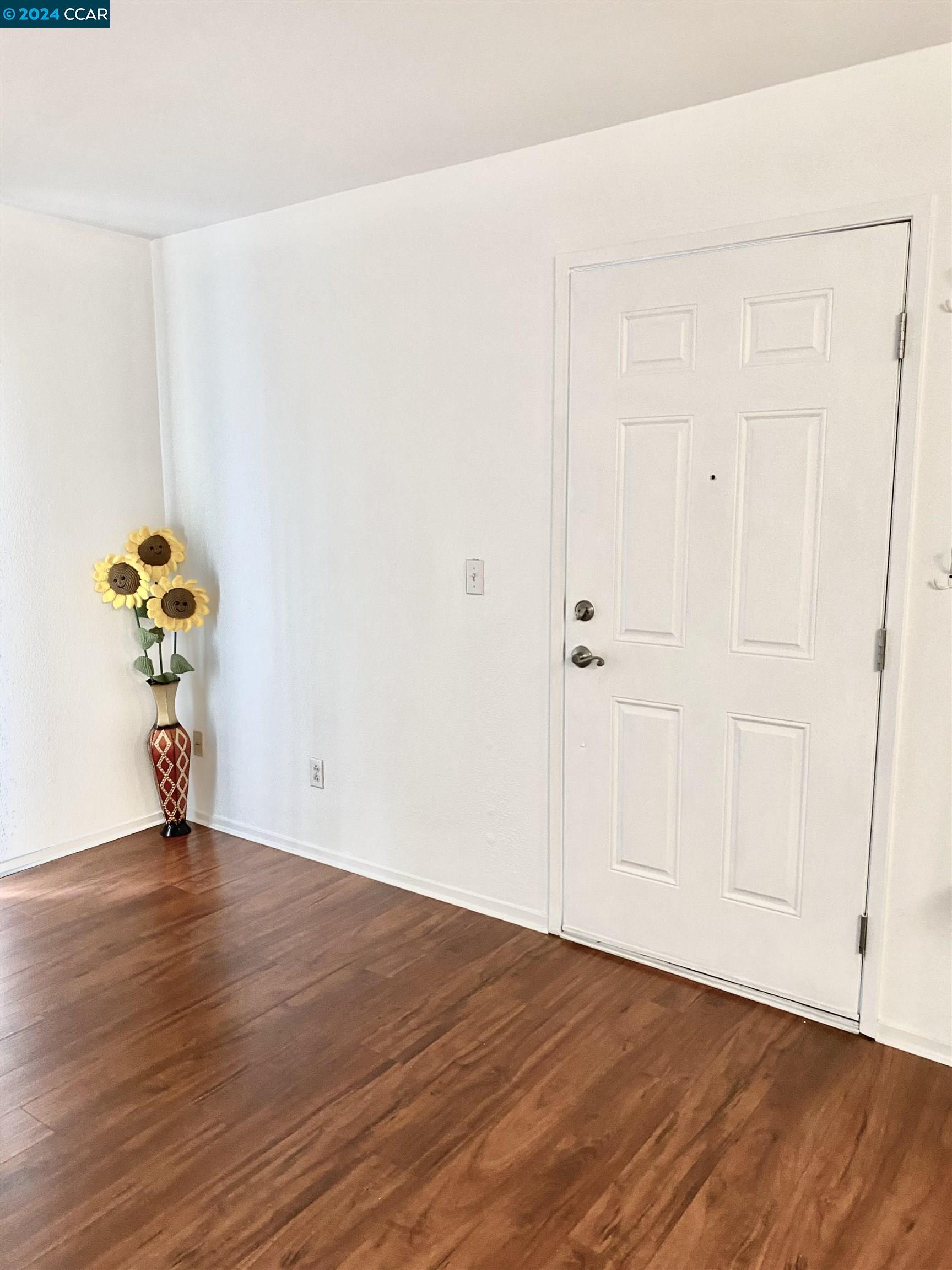 222 Piedmont Lane Pittsburg, CA 94565 - Photo 4 of 25 a view of an empty room with wooden floor