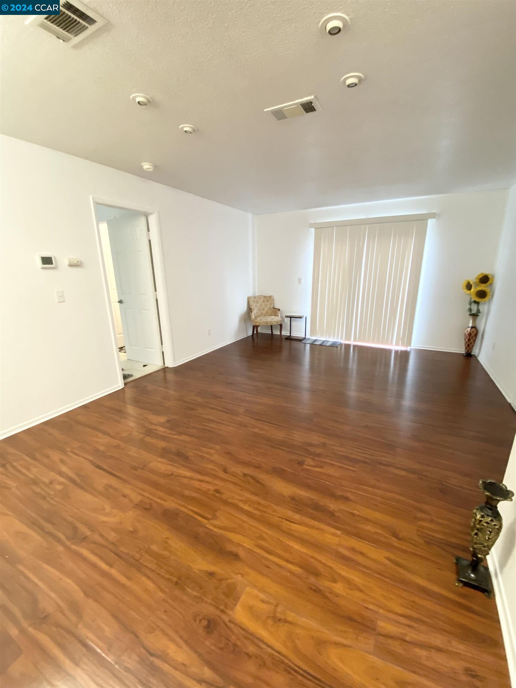 222 Piedmont Lane Pittsburg, CA 94565 - Photo 5 of 25 a view of empty room with wooden floor and fan