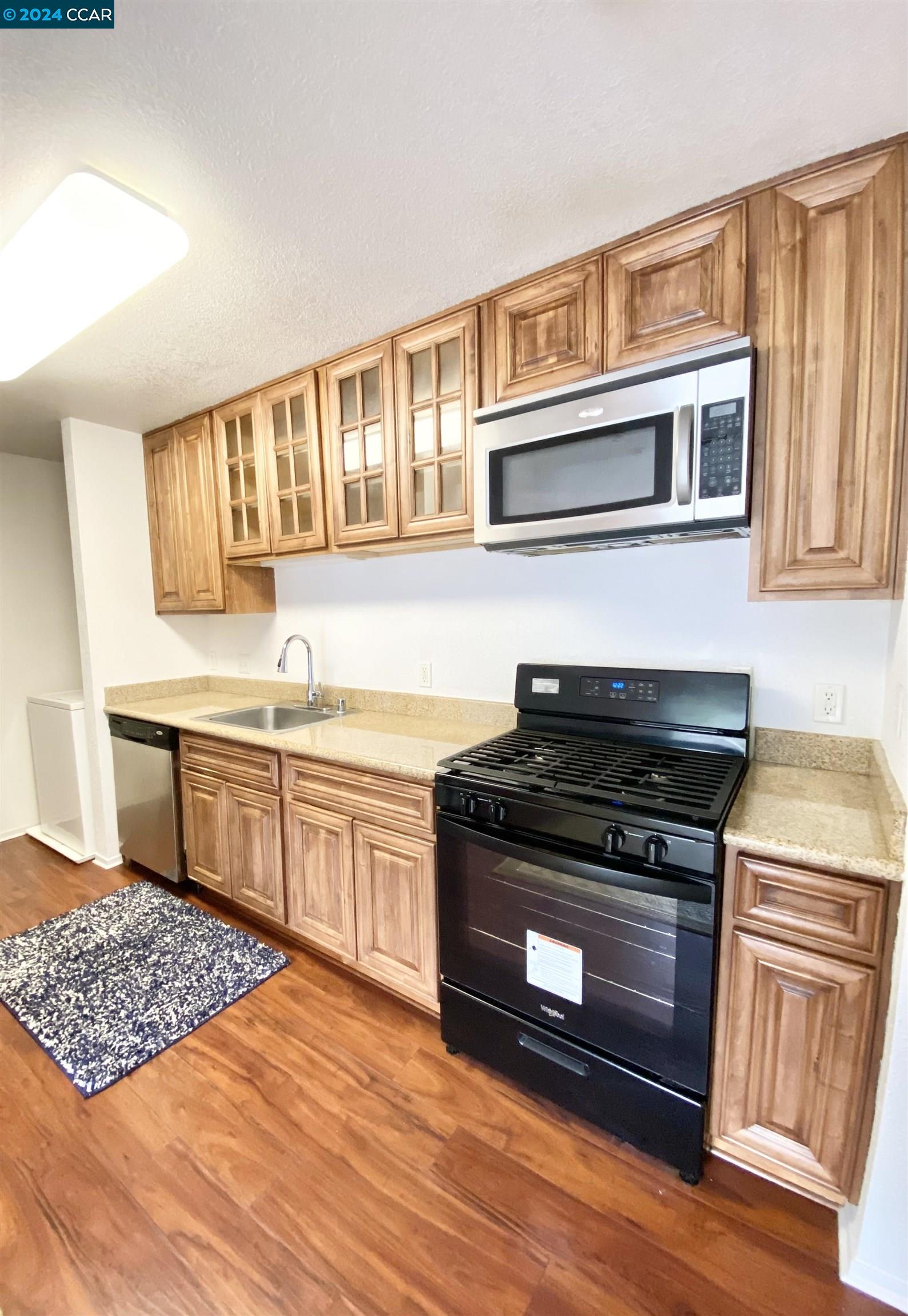 222 Piedmont Lane Pittsburg, CA 94565 - Photo 9 of 25 a kitchen with stainless steel appliances granite countertop a stove and a sink