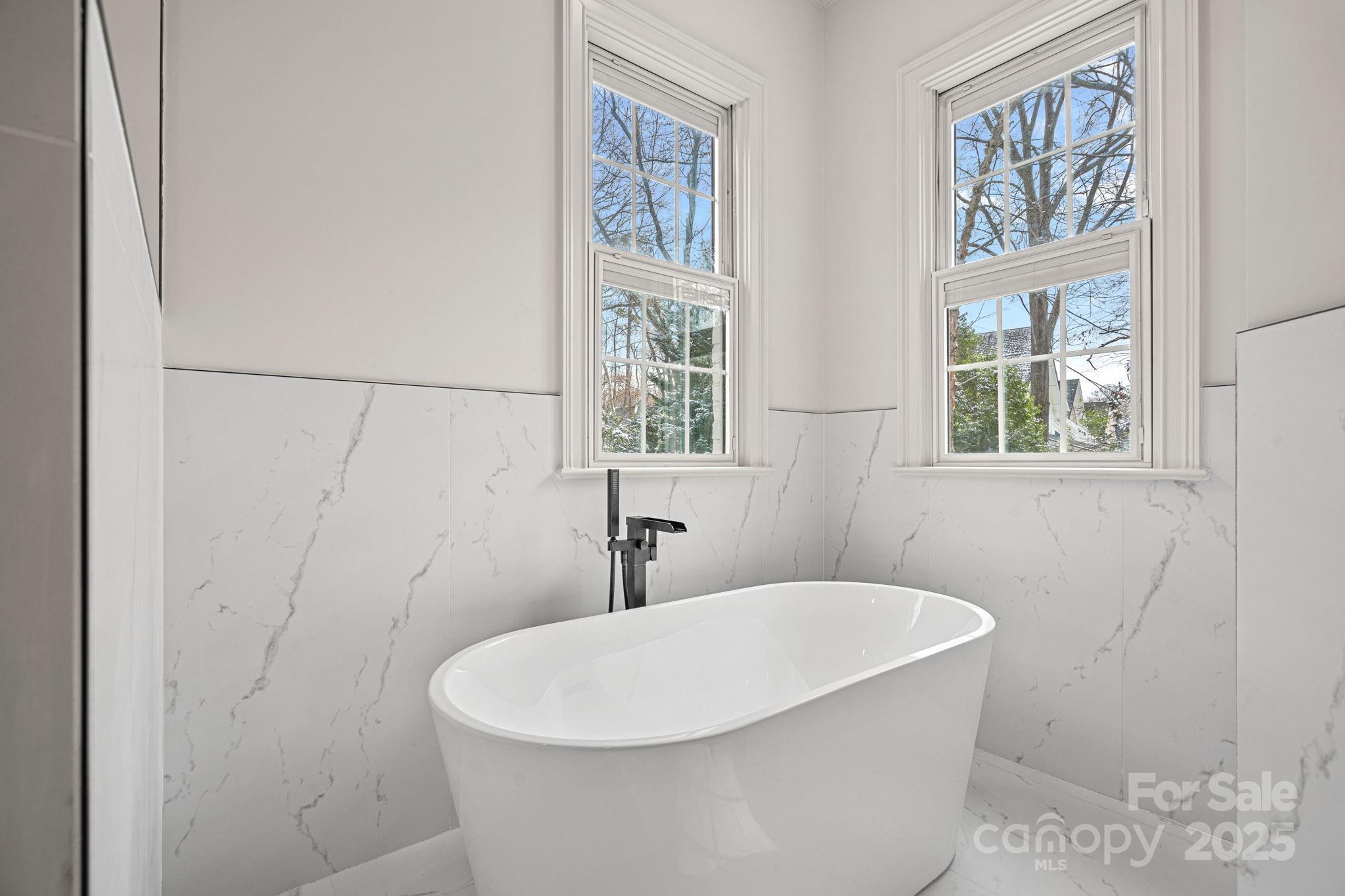 357 Magnolia Street Davidson, NC 28036 - Photo 27 of 48 a white bath tub sitting next to a white sink