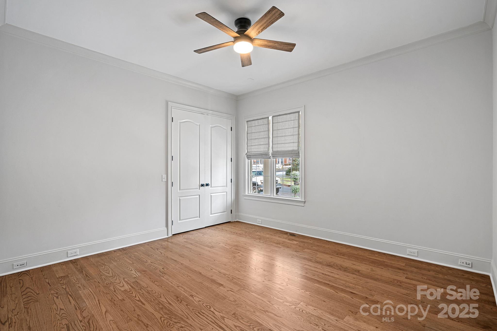 357 Magnolia Street Davidson, NC 28036 - Photo 29 of 48 wooden floor in an empty room with a window