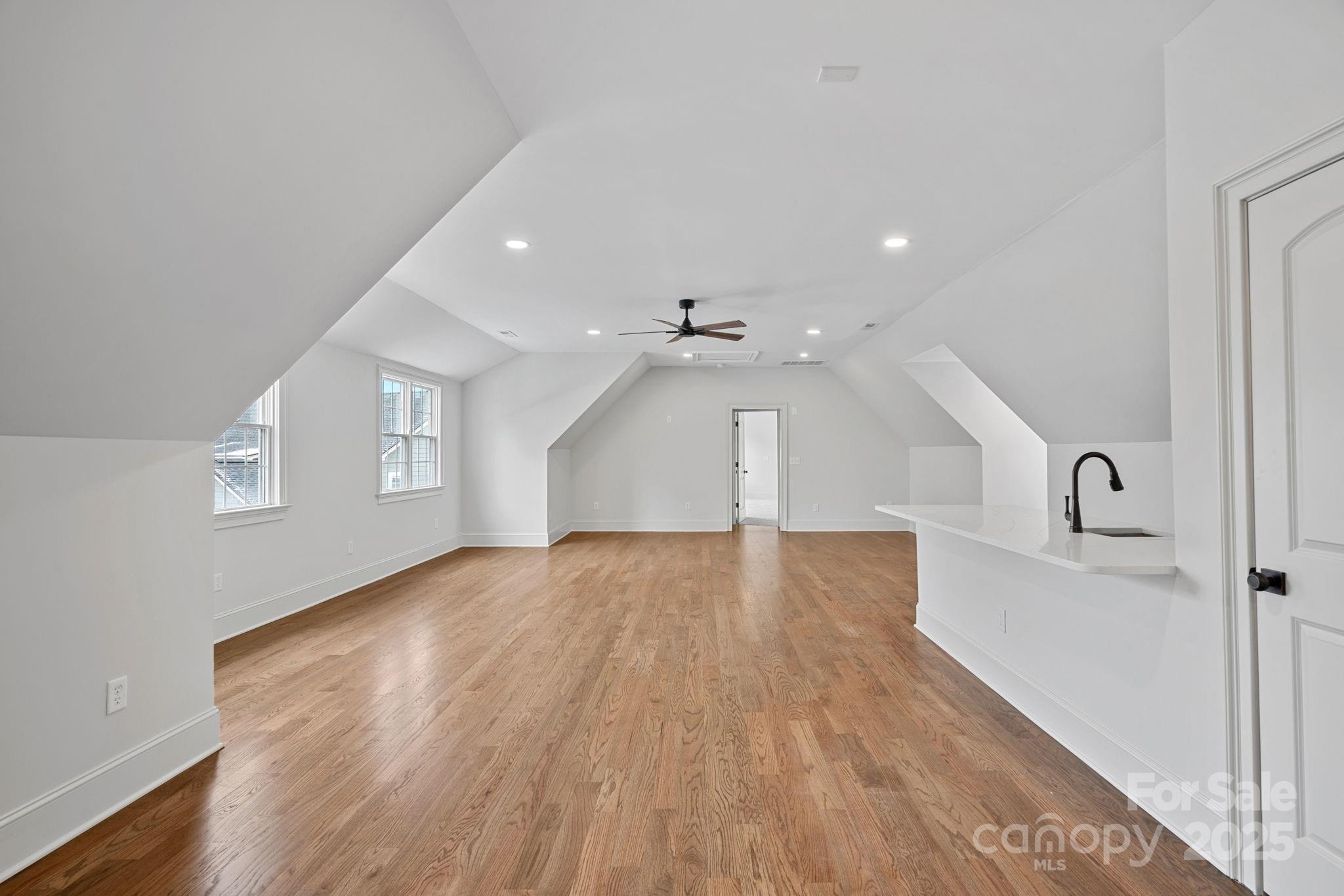 357 Magnolia Street Davidson, NC 28036 - Photo 32 of 48 wooden floor in an empty room with a window