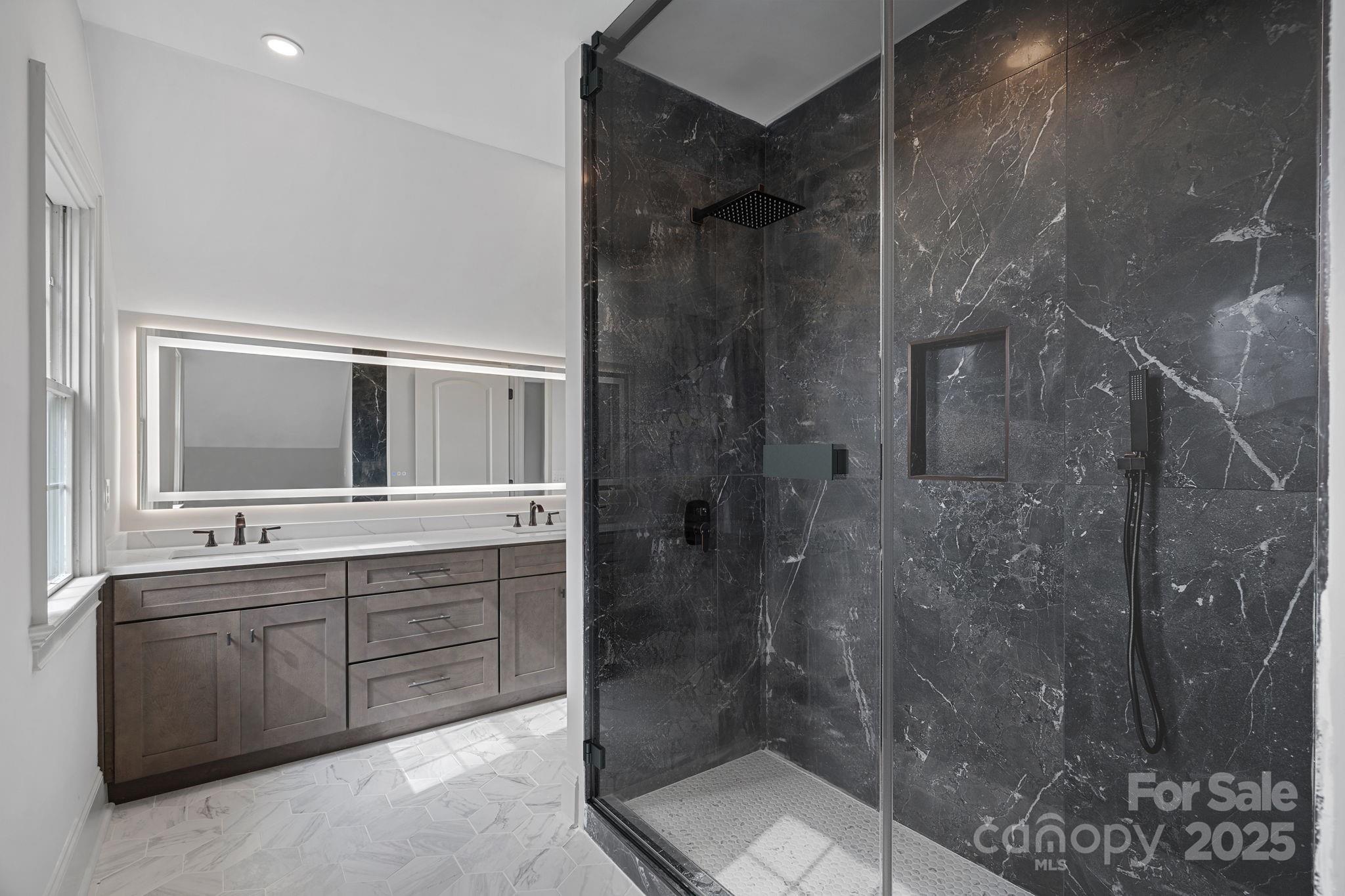 357 Magnolia Street Davidson, NC 28036 - Photo 40 of 48 a spacious bathroom with a shower and a sink