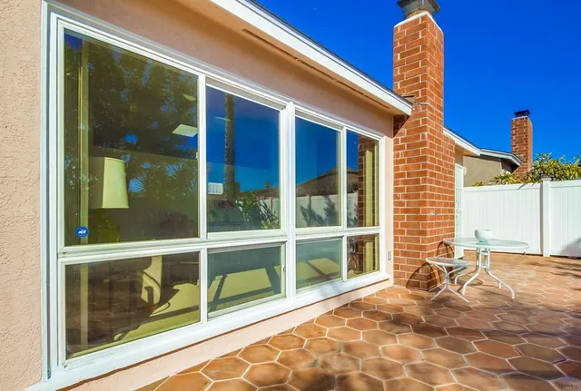 a view of a porch with a floor to ceiling windows
