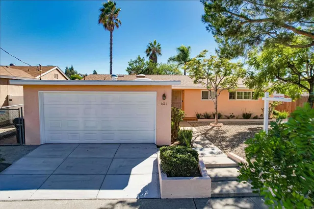 a house view with a garden space