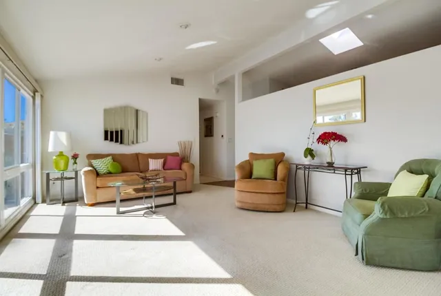 a living room with furniture and a couch