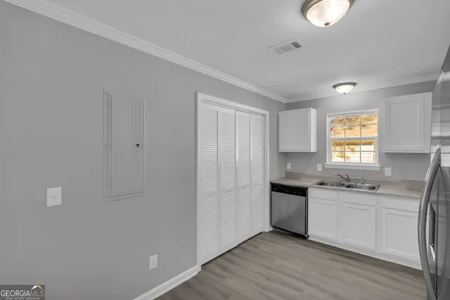 a kitchen with a sink stove and refrigerator