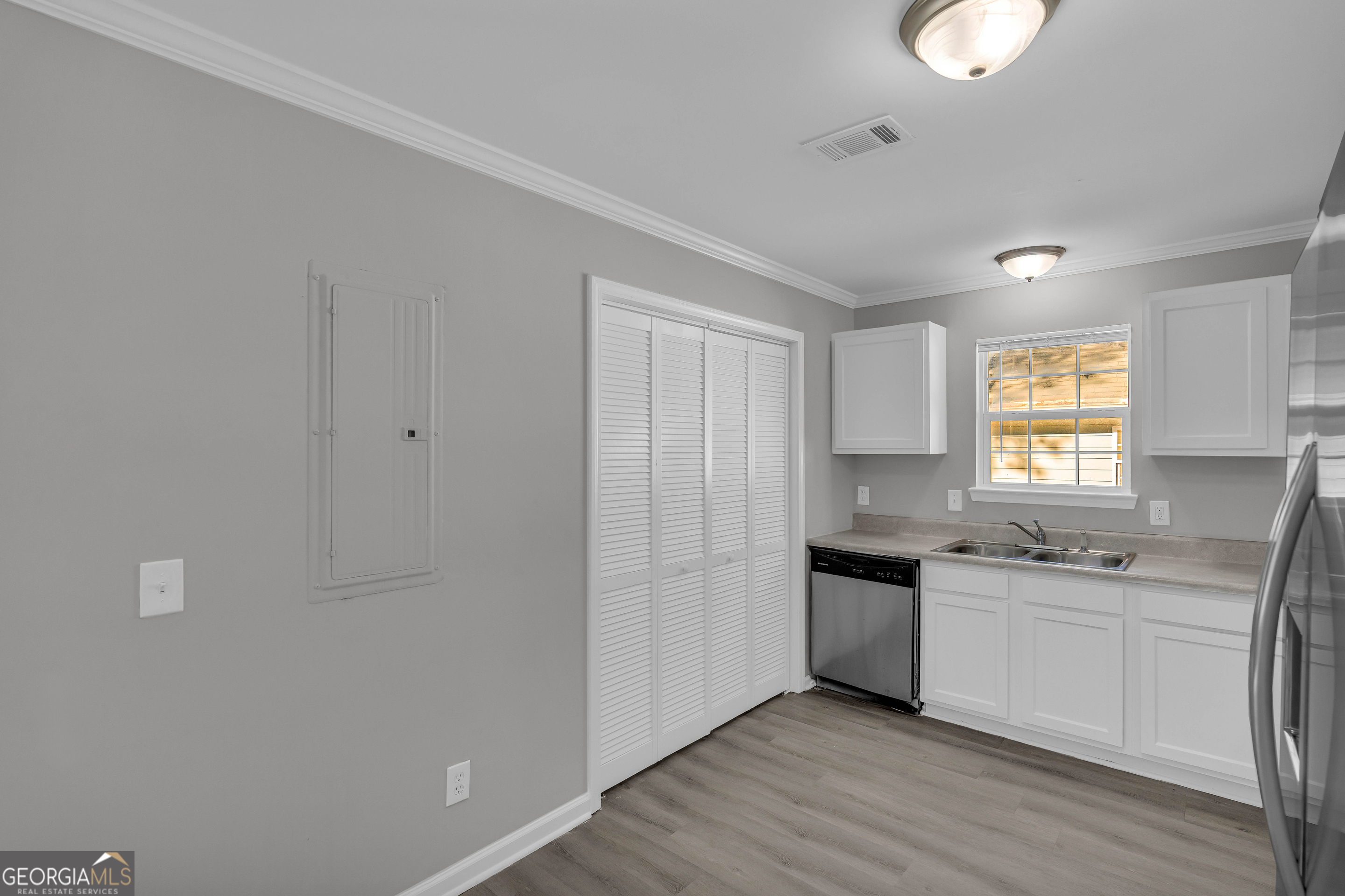 1040 Thomasville Estates Drive Southeast Atlanta, GA 30315 - Photo 12 of 57 a kitchen with a sink cabinets and window