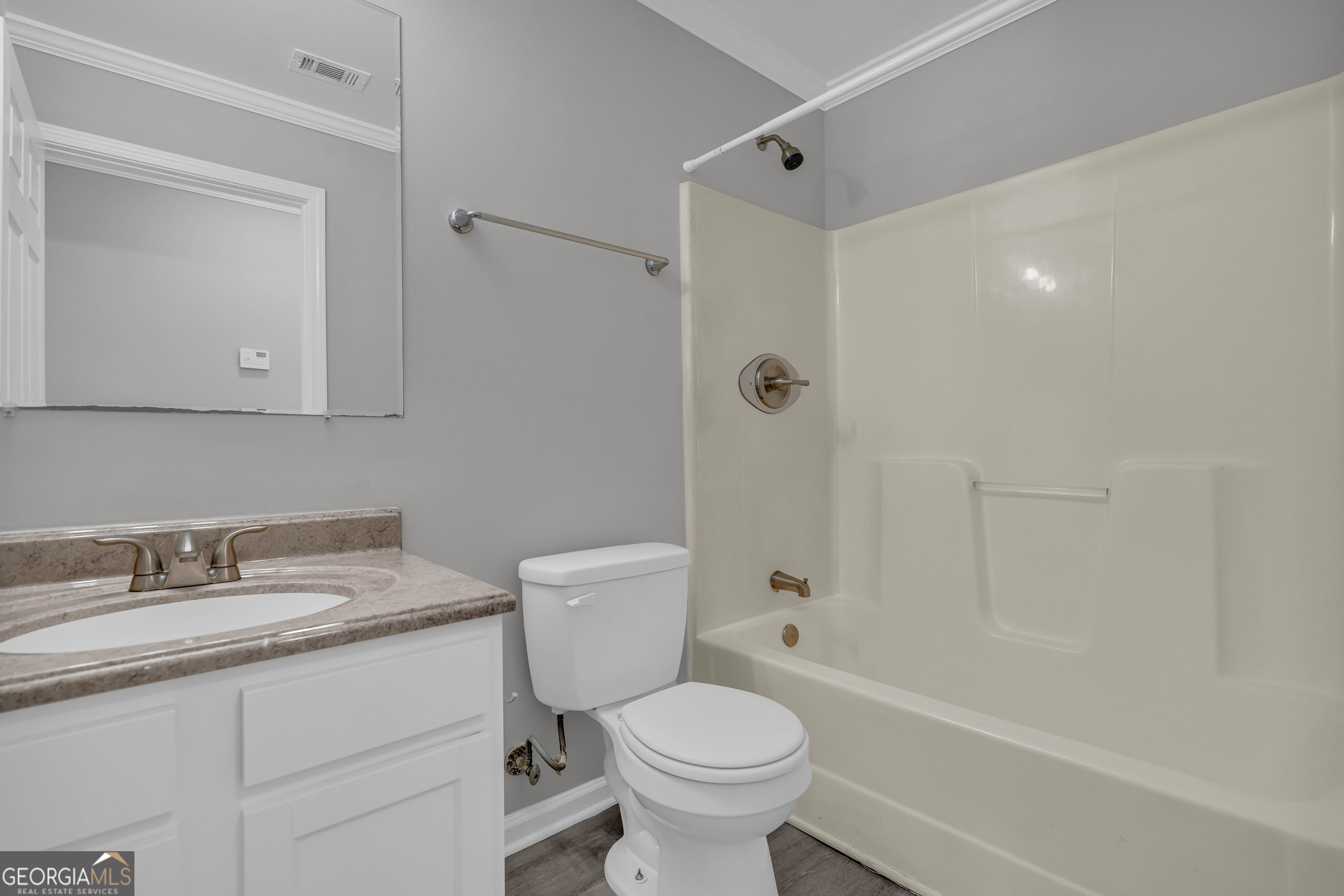 1040 Thomasville Estates Drive Southeast Atlanta, GA 30315 - Photo 17 of 57 a bathroom with a sink toilet vanity and shower