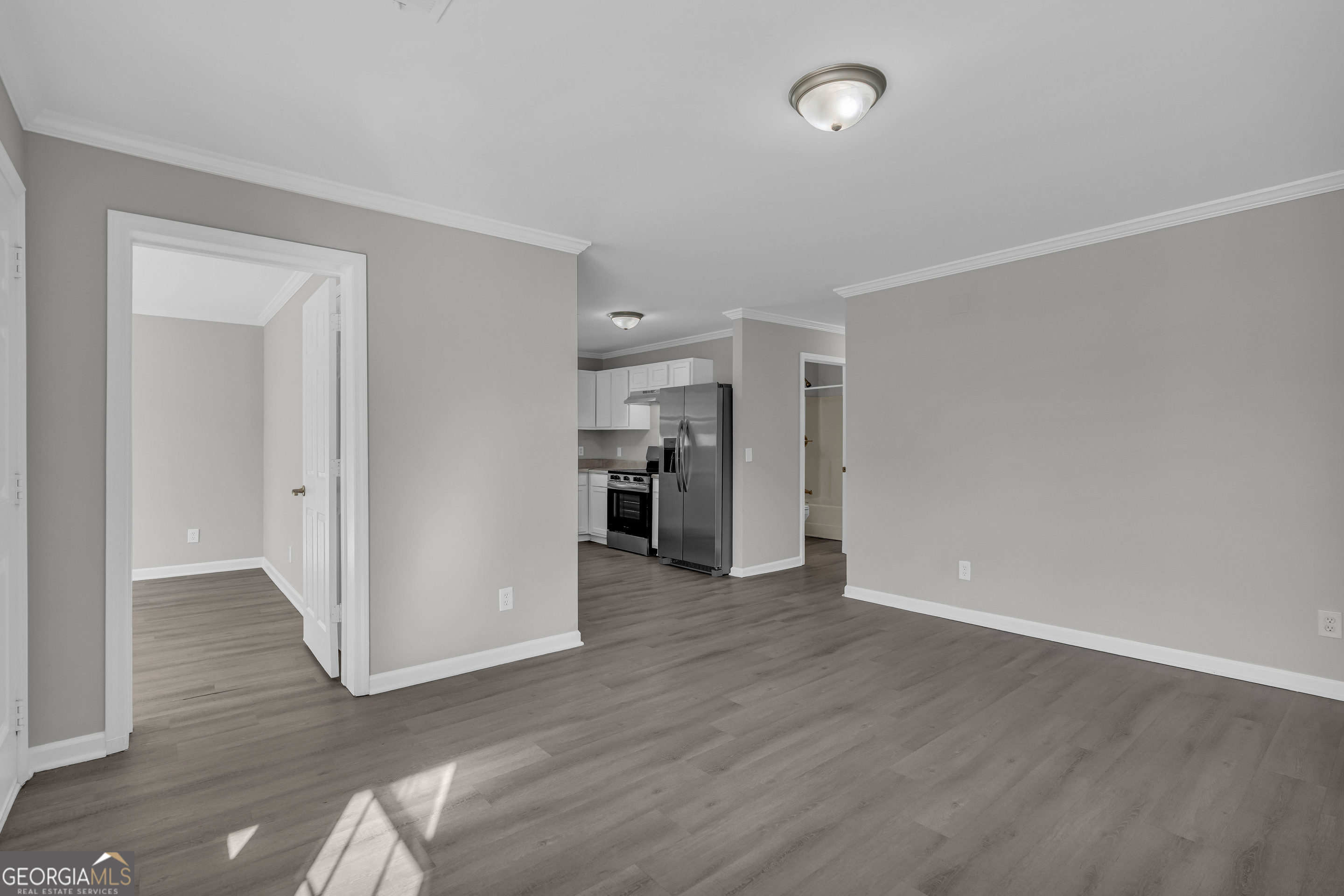1040 Thomasville Estates Drive Southeast Atlanta, GA 30315 - Photo 18 of 57 an empty room with wooden floor and closet