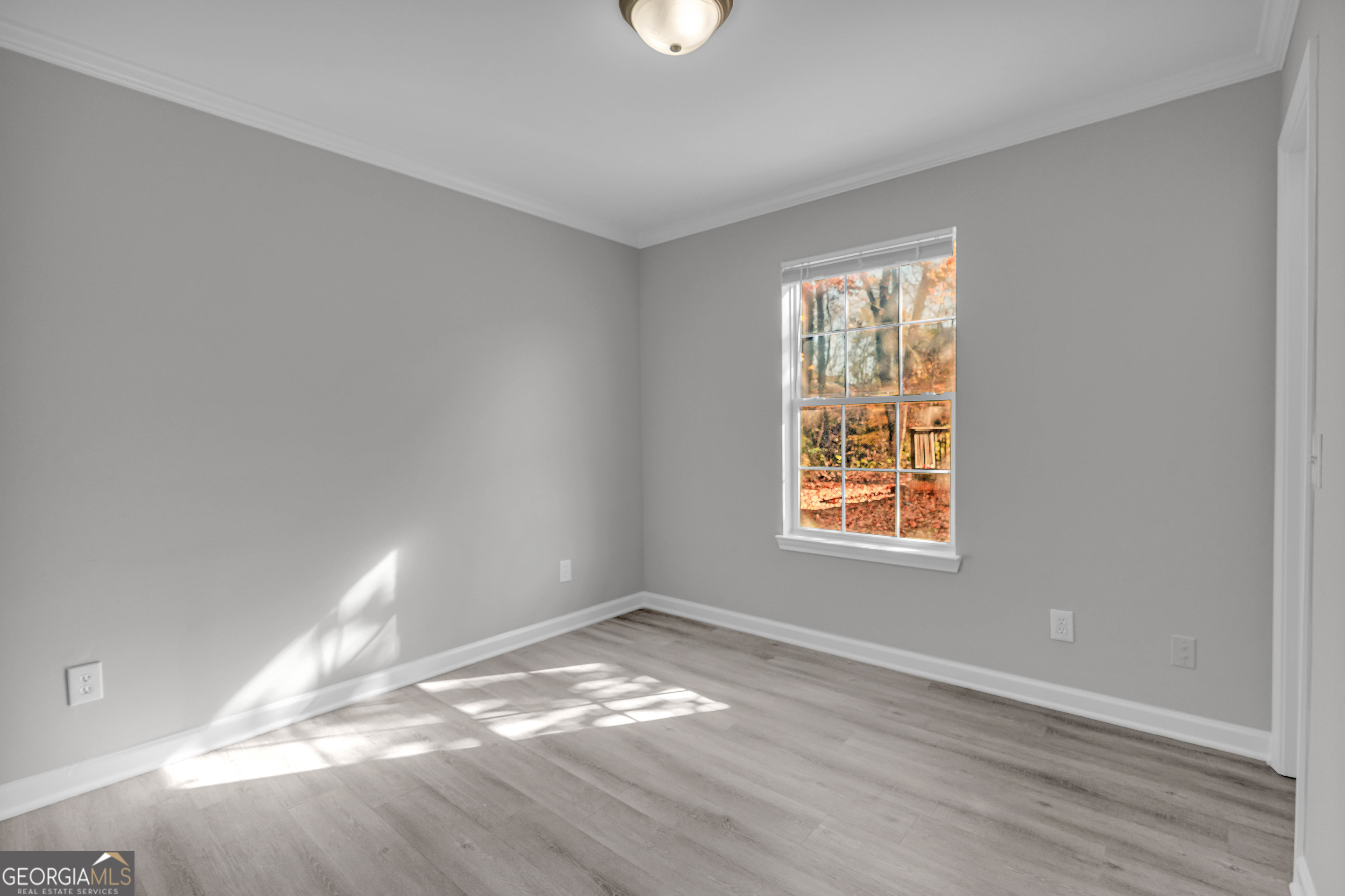1040 Thomasville Estates Drive Southeast Atlanta, GA 30315 - Photo 21 of 57 a view of empty room with wooden floor and fan
