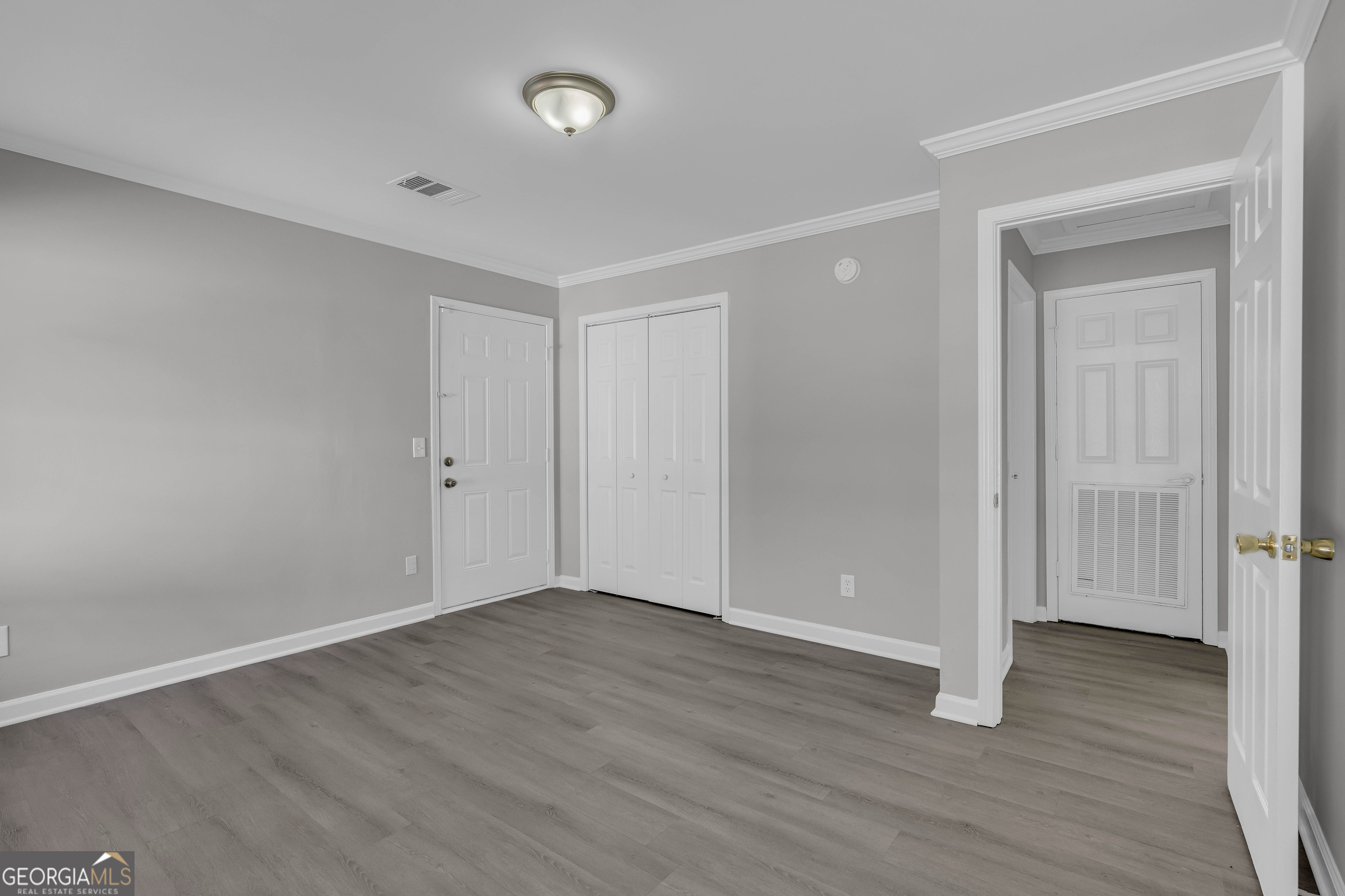 1040 Thomasville Estates Drive Southeast Atlanta, GA 30315 - Photo 23 of 57 a view of an empty room with wooden floor