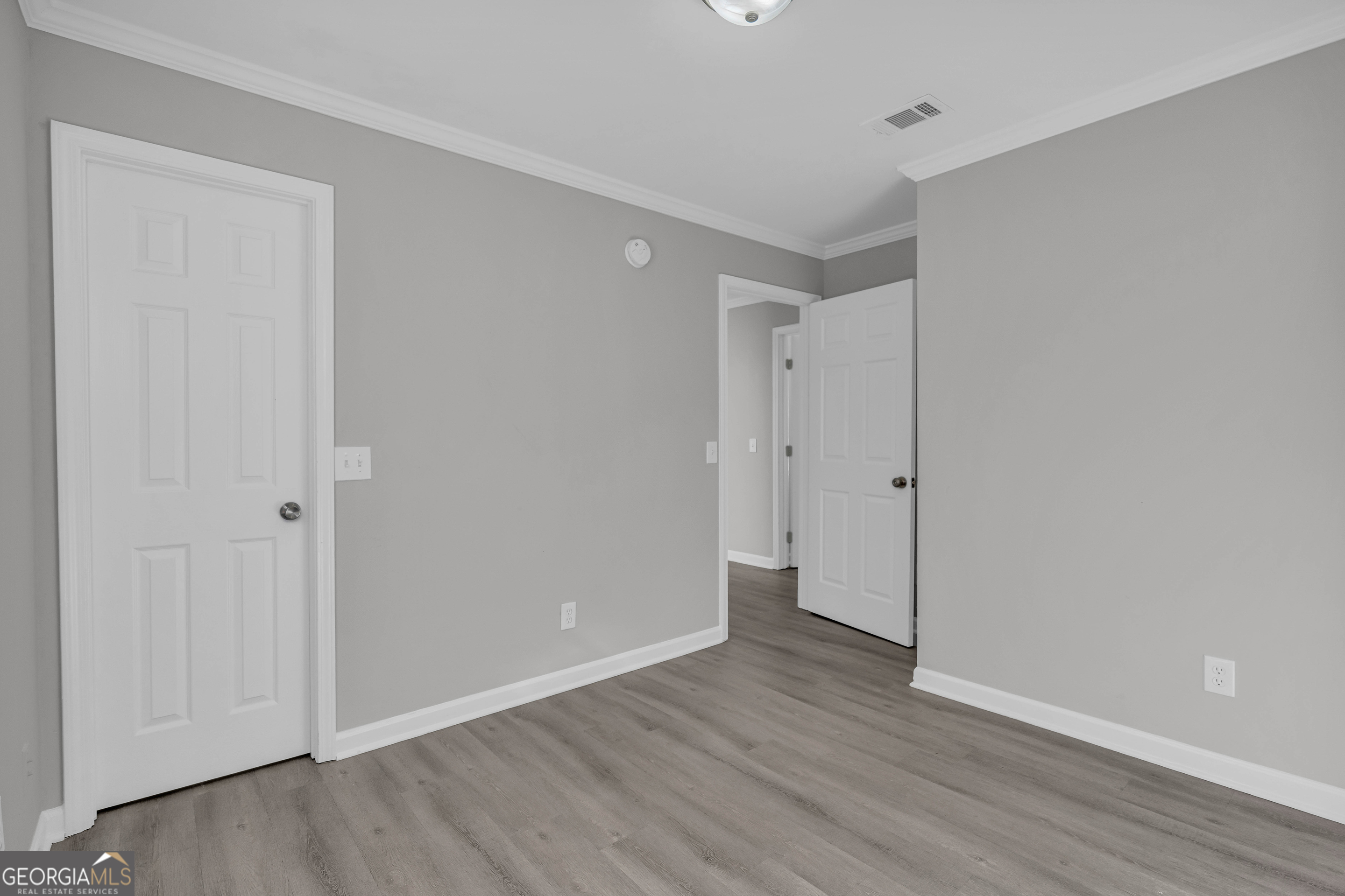 1040 Thomasville Estates Drive Southeast Atlanta, GA 30315 - Photo 30 of 57 a view of an empty room with wooden floor