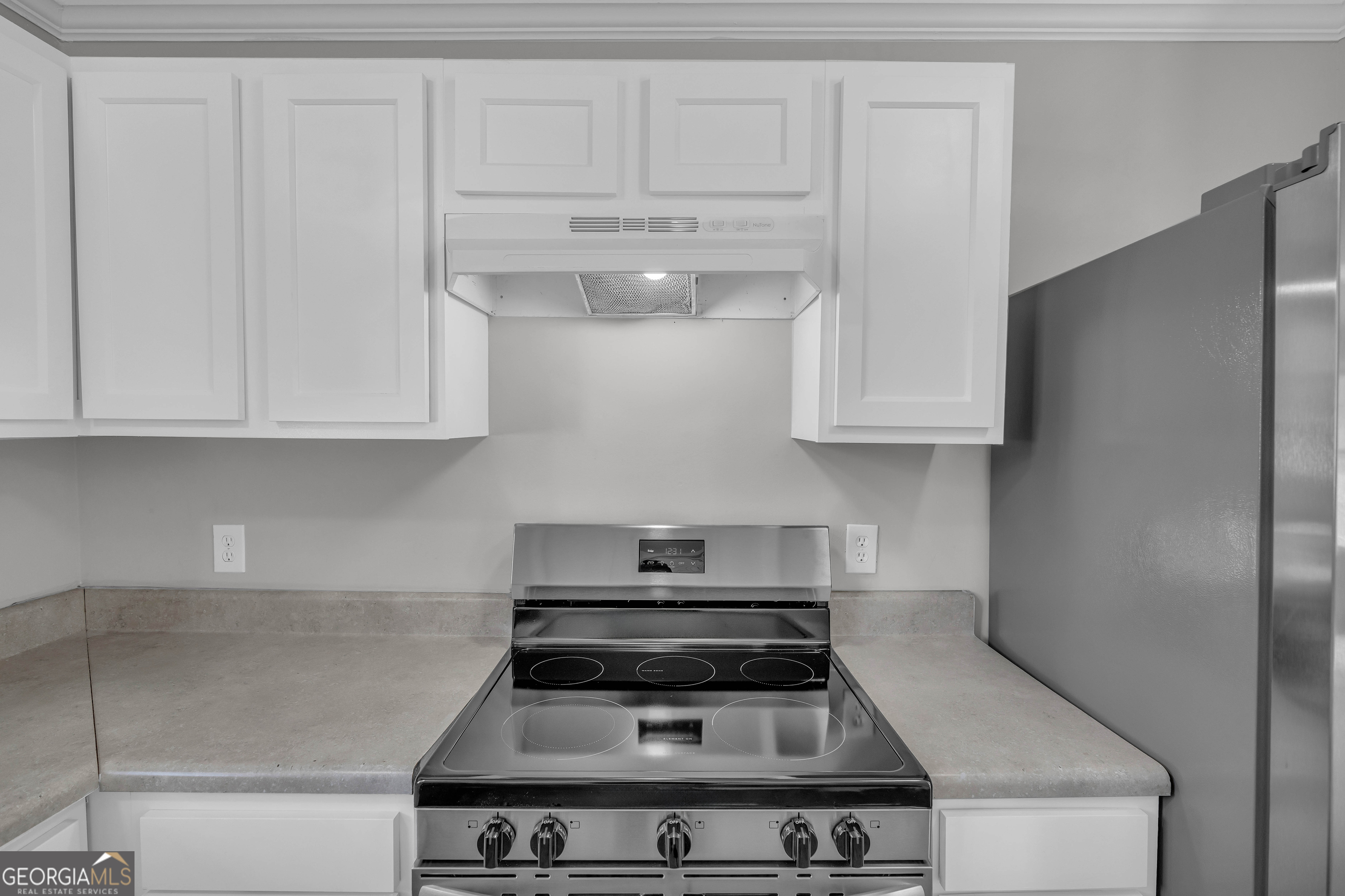 1040 Thomasville Estates Drive Southeast Atlanta, GA 30315 - Photo 35 of 57 a stove top oven sitting inside of a kitchen