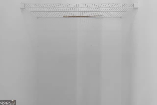 a view of dirt yard with a tree