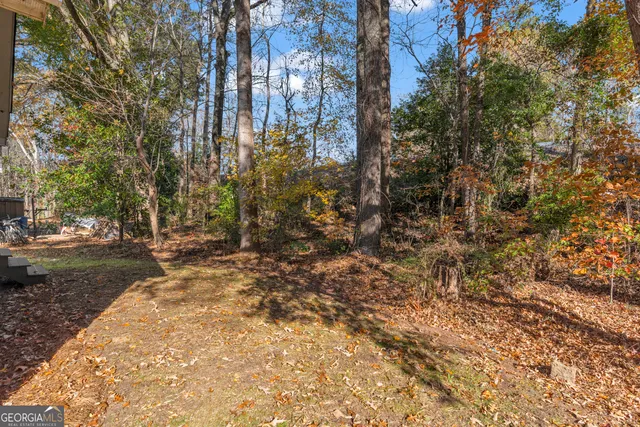 a view of a backyard of the house