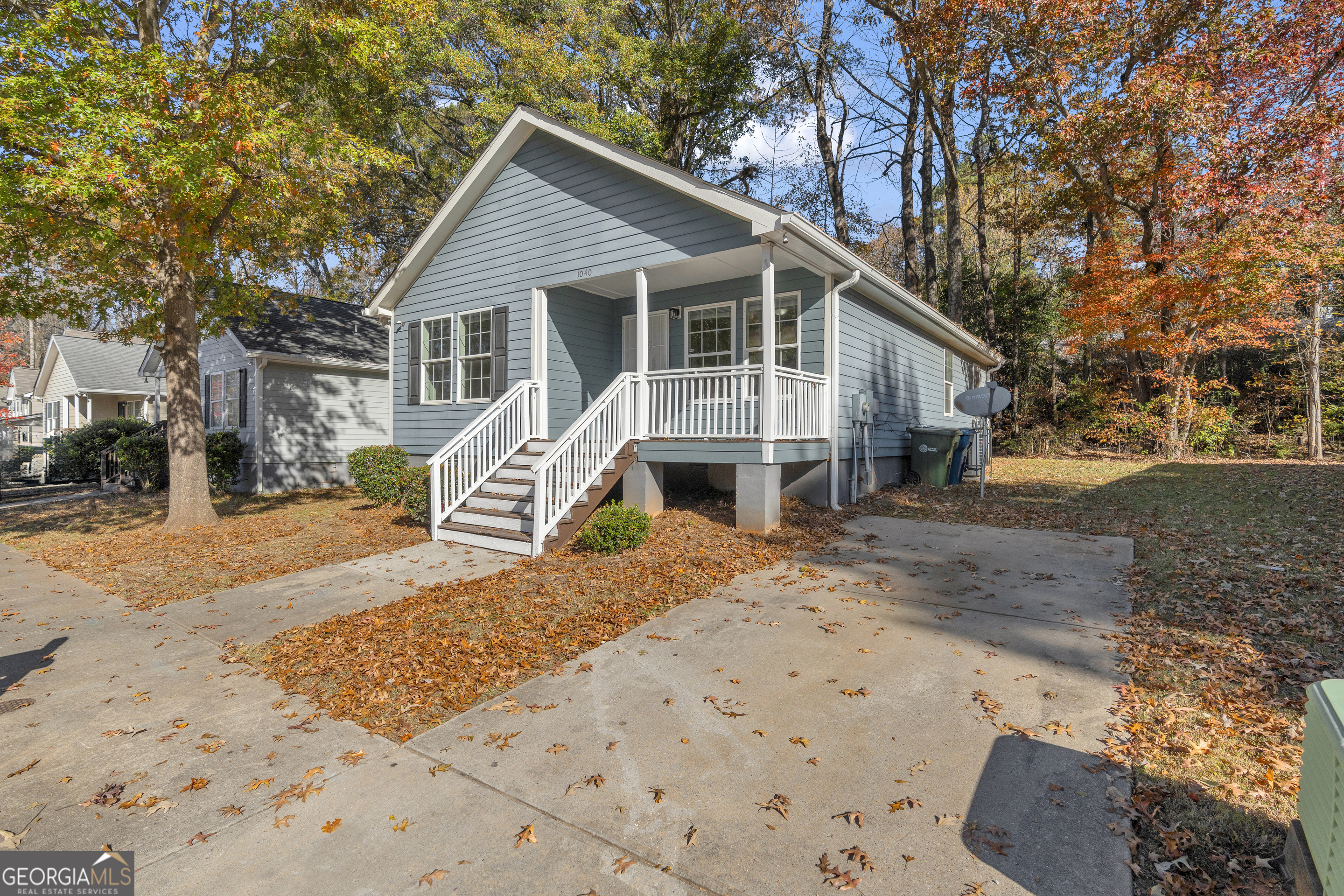1040 Thomasville Estates Drive Southeast Atlanta, GA 30315 - Photo 47 of 57 a front view of a house with a yard covered in snow