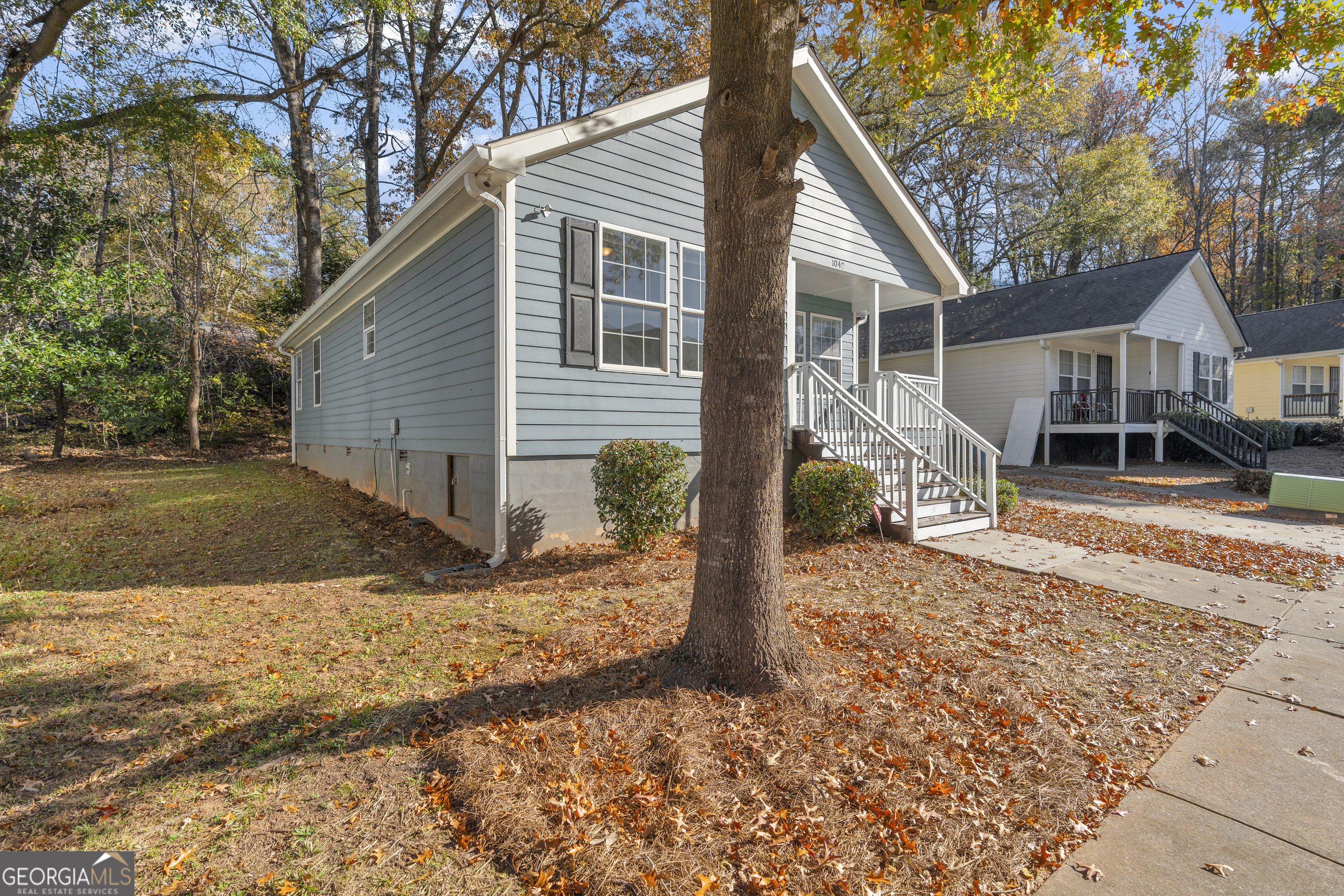 1040 Thomasville Estates Drive Southeast Atlanta, GA 30315 - Photo 48 of 57 a view of a house with a yard covered in snow
