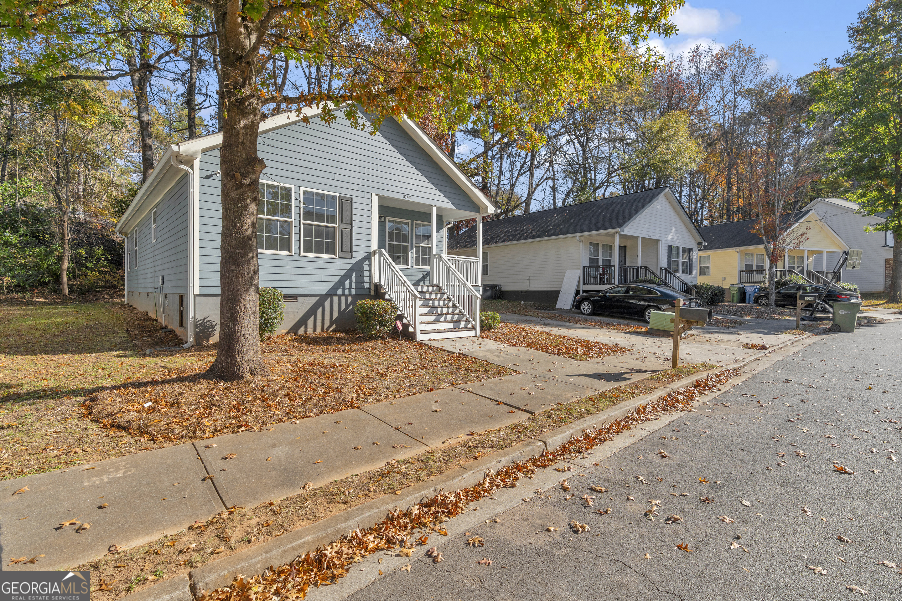 1040 Thomasville Estates Drive Southeast Atlanta, GA 30315 - Photo 49 of 57 a front view of a house with a yard covered in snow