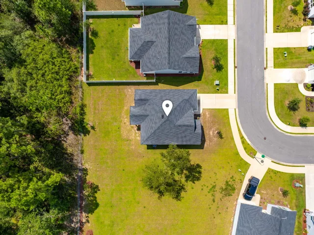 an aerial view of residential house with swimming pool