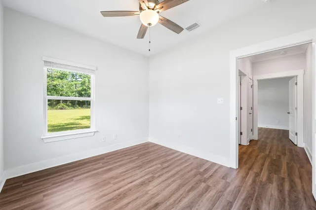 a bathroom with a sink vanity and a mirror