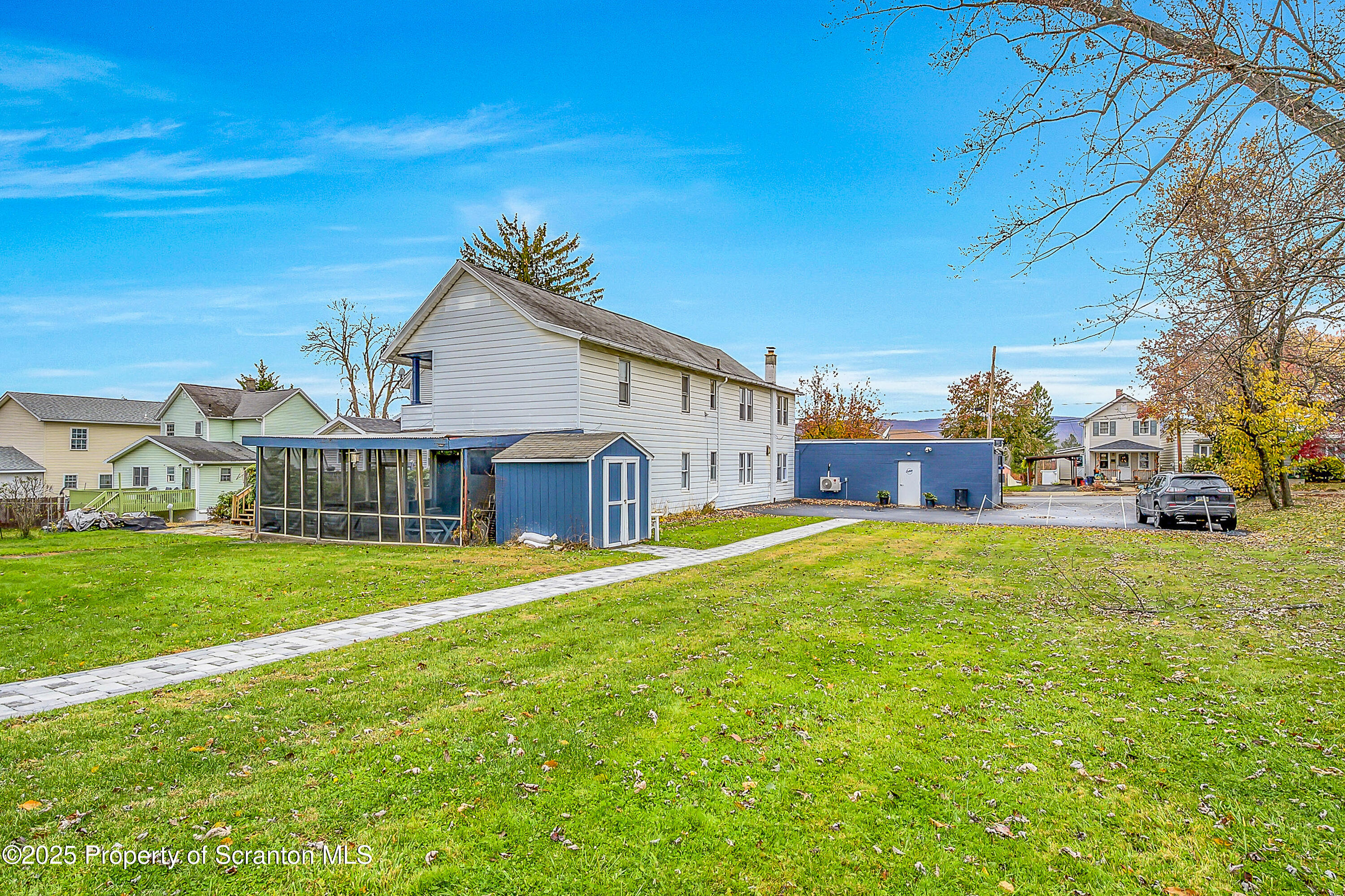 2819 Birney Avenue Scranton, PA 18505 - Photo 2 of 20 a front view of a house with a garden and porch