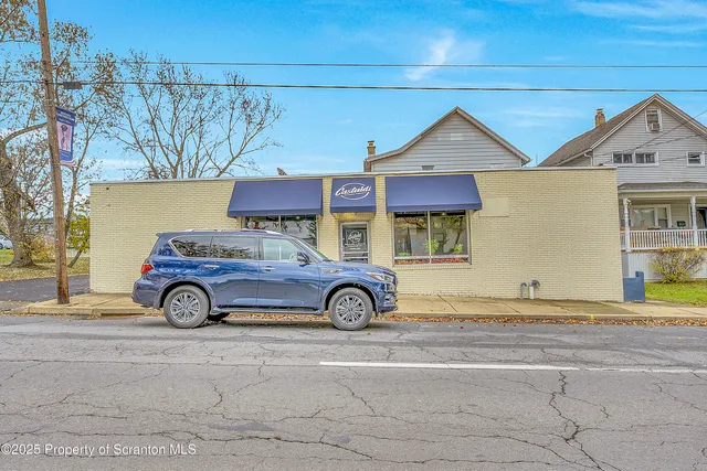 a view of yard with car parked