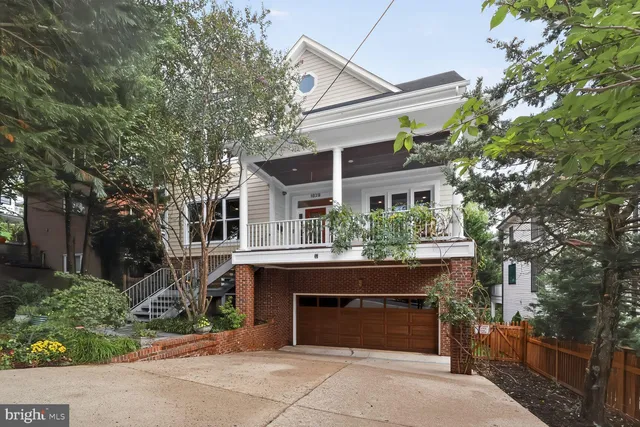 a front view of a house with yard