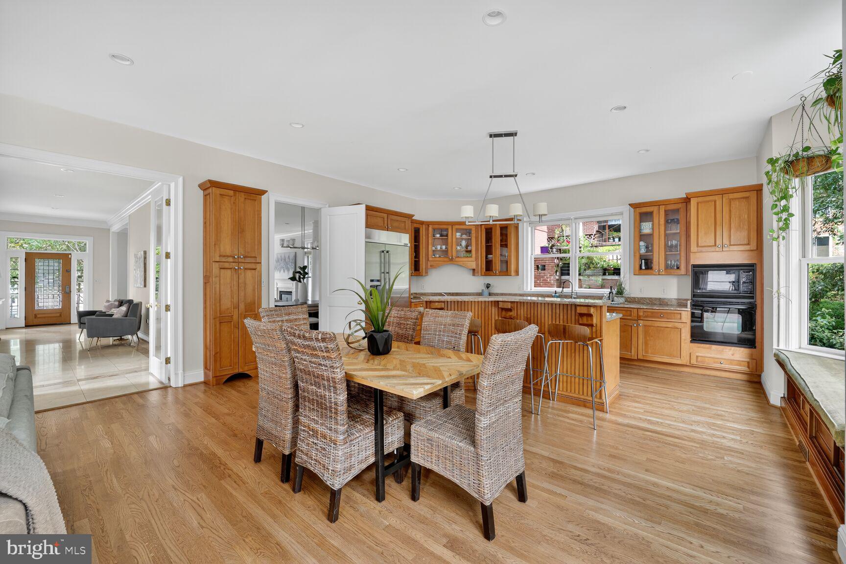 1829 47th Place Northwest Washington, DC 20007 - Photo 14 of 44 a view of a dining room with furniture and wooden floor