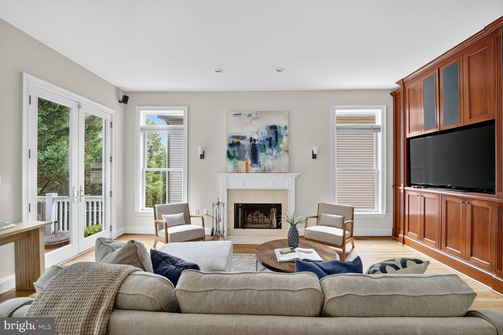 1829 47th Place Northwest Washington, DC 20007 - Photo 16 of 44 a living room with furniture flat screen tv and a fireplace