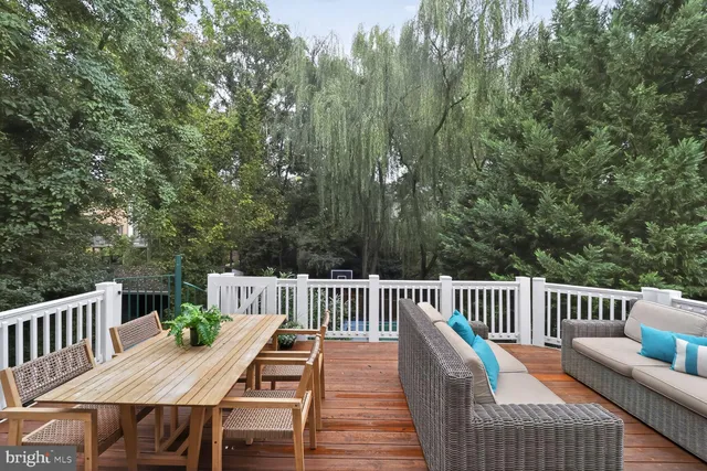 a view of a deck with furniture and wooden floor