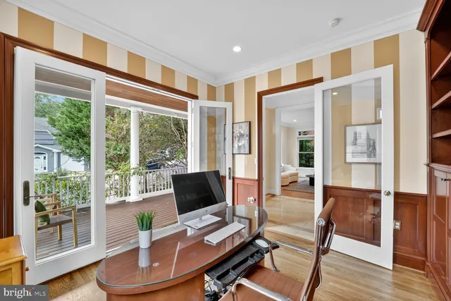 a work room with furniture and wooden floor