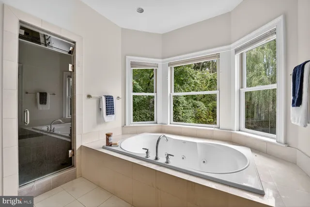 a bathroom with a tub and a sink