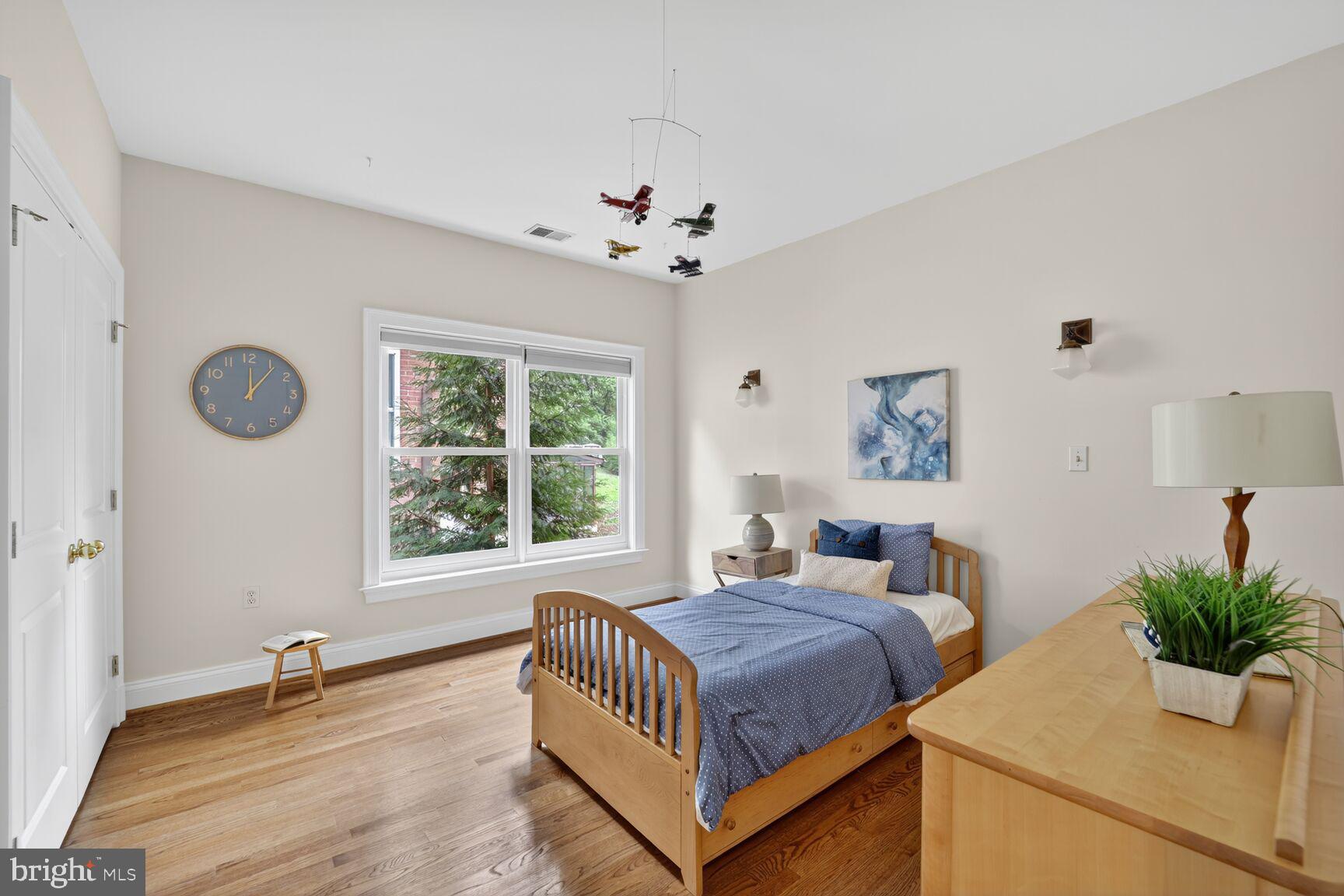 1829 47th Place Northwest Washington, DC 20007 - Photo 29 of 44 a bedroom with a large bed and a window