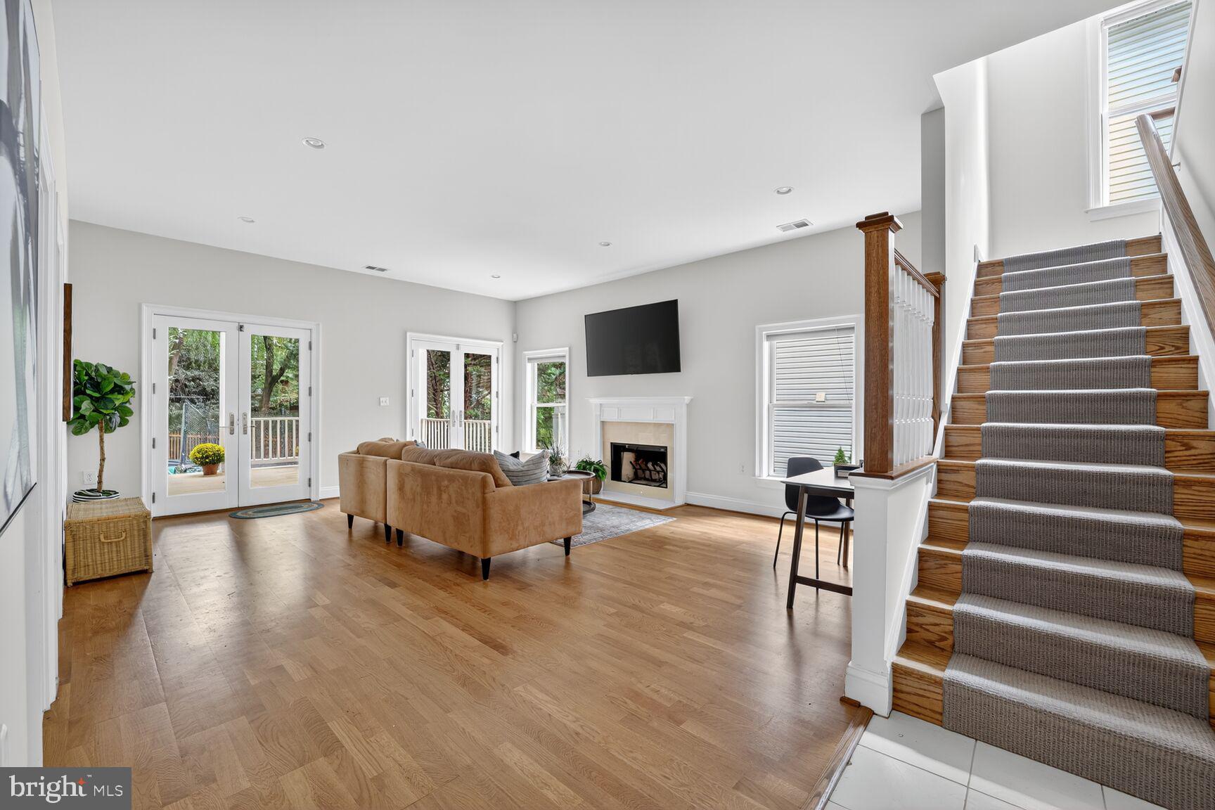 1829 47th Place Northwest Washington, DC 20007 - Photo 32 of 44 a living room with furniture and a fireplace
