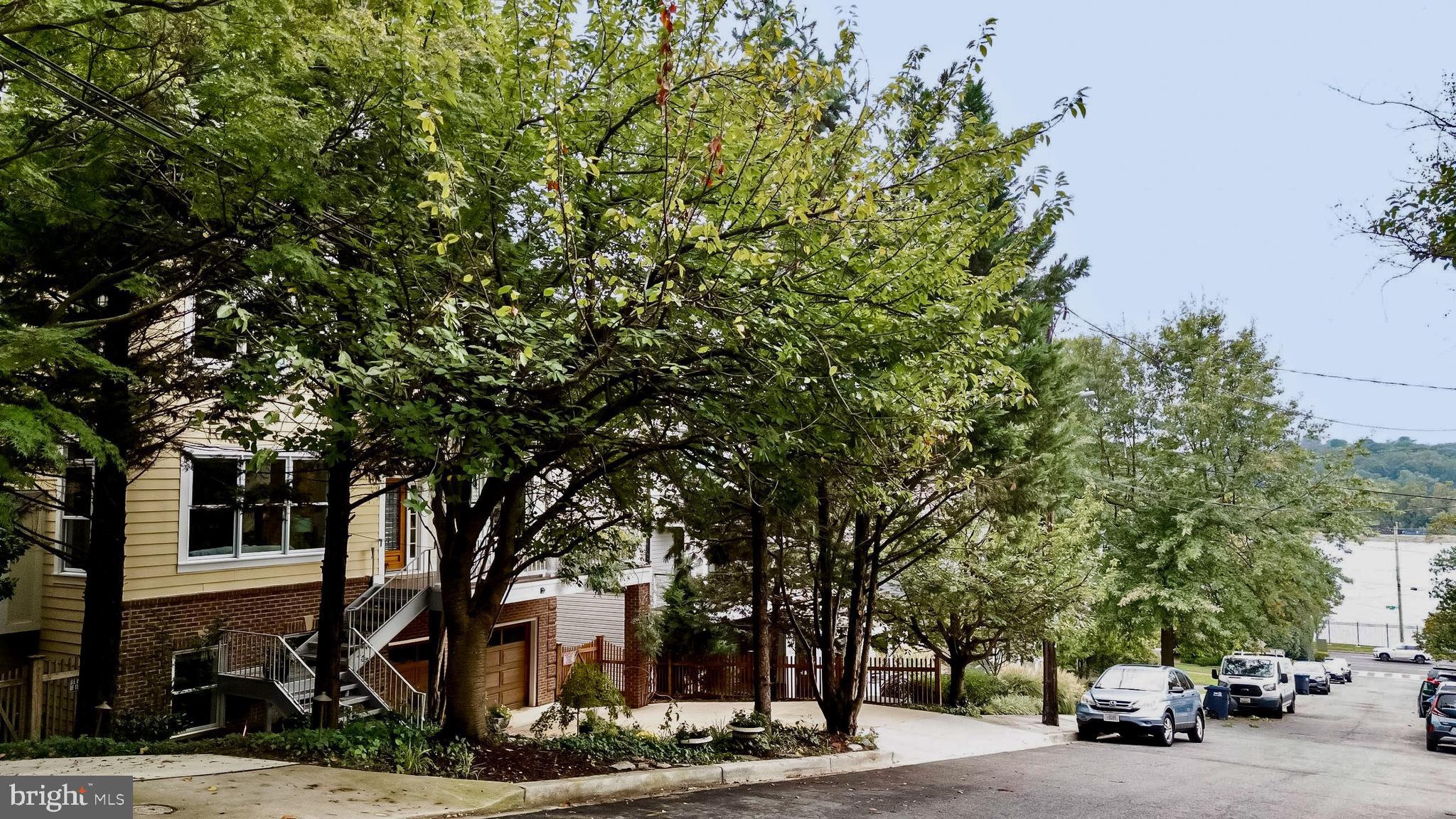 1829 47th Place Northwest Washington, DC 20007 - Photo 44 of 44 a car parked in front of a white house